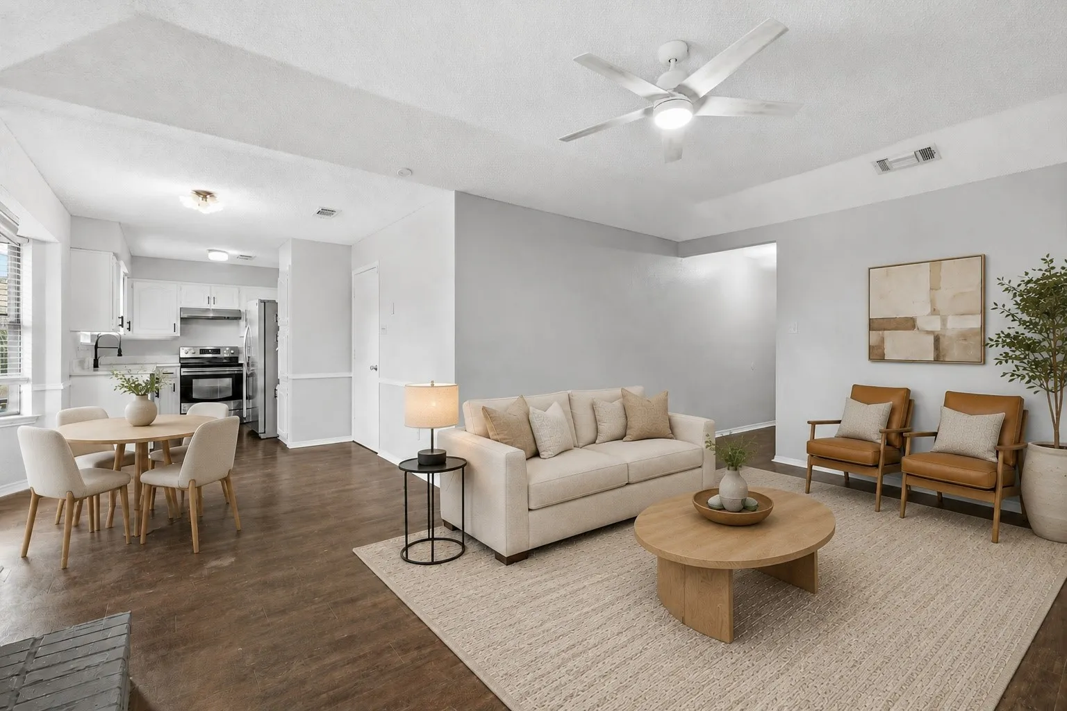 Virtually Staged Expansive living area with wood-finish flooring, a ceiling fan, and recessed lighting