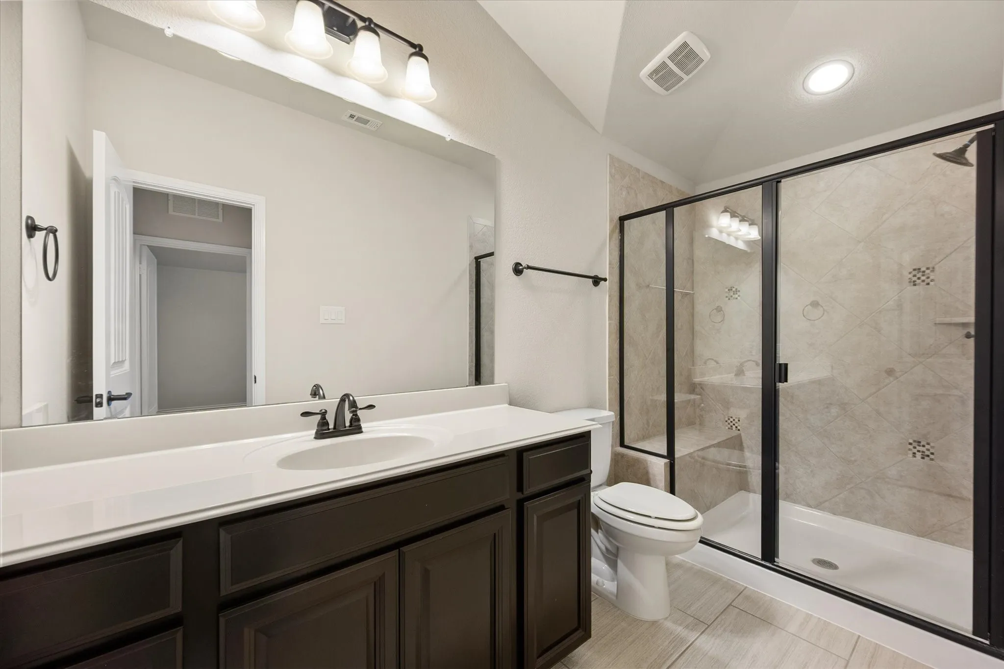Upstairs bathroom is spacious and beautiful.