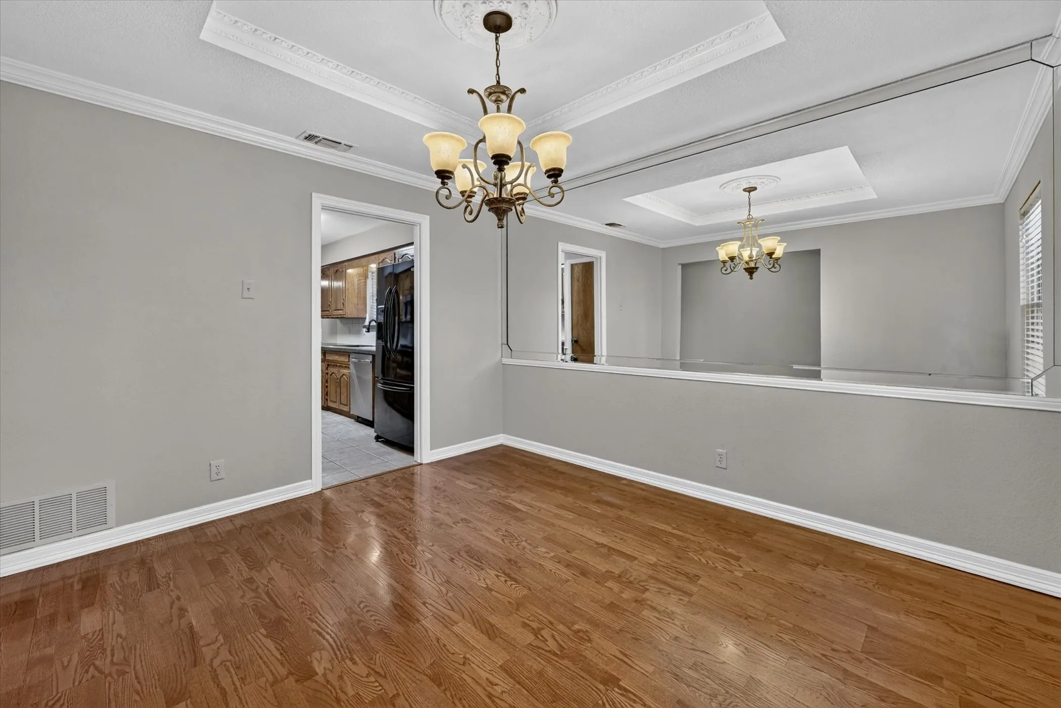Formal dining room with entry to kitchen for easy entertaining