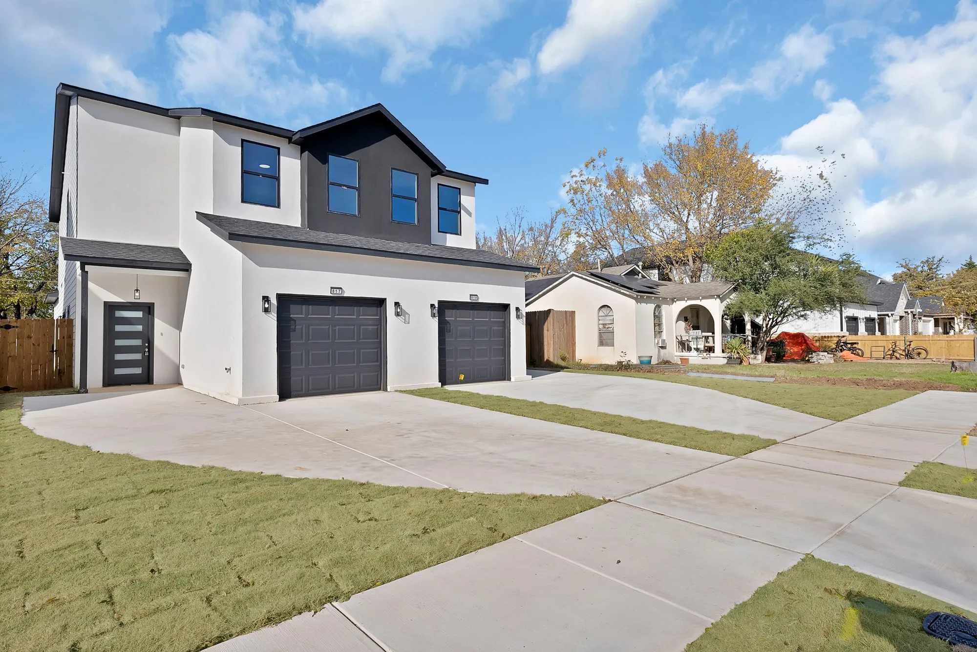 Modern facade with white stucco and dark accent panels