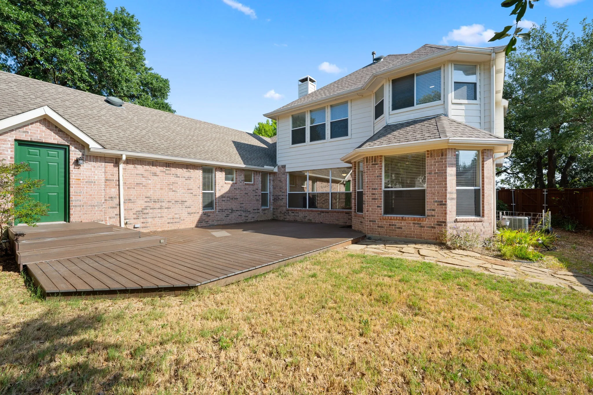 Expansive deck with multi-level design and direct exterior access