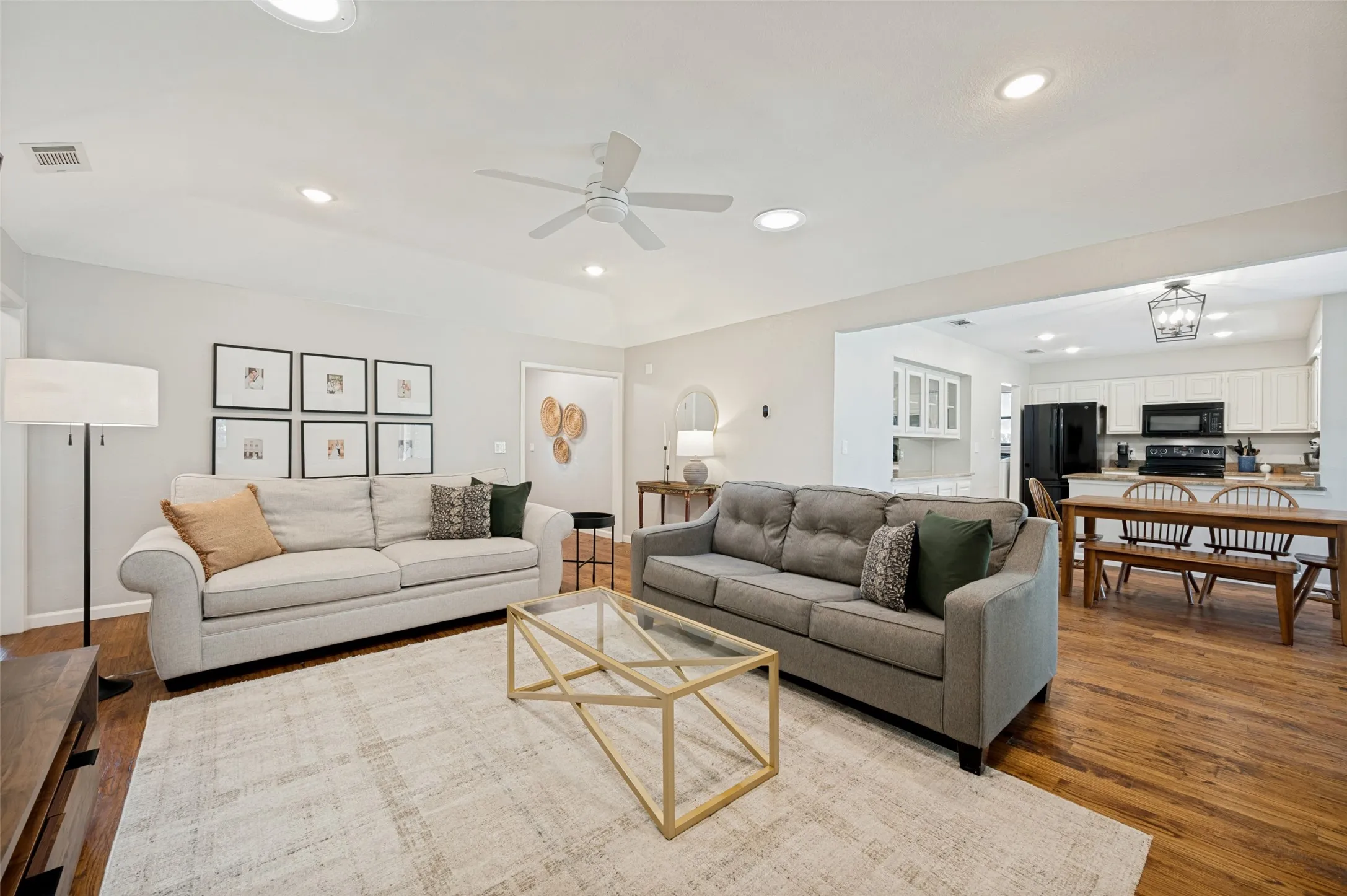 Bright open living area with recessed lighting