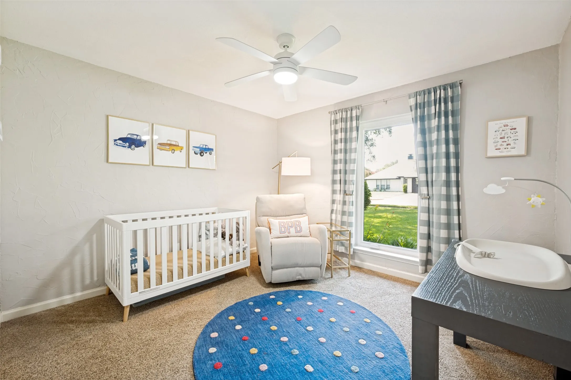 3rd Bedroom features light gray textured walls, wall-to-wall carpeting, and a ceiling fan with integrated lighting