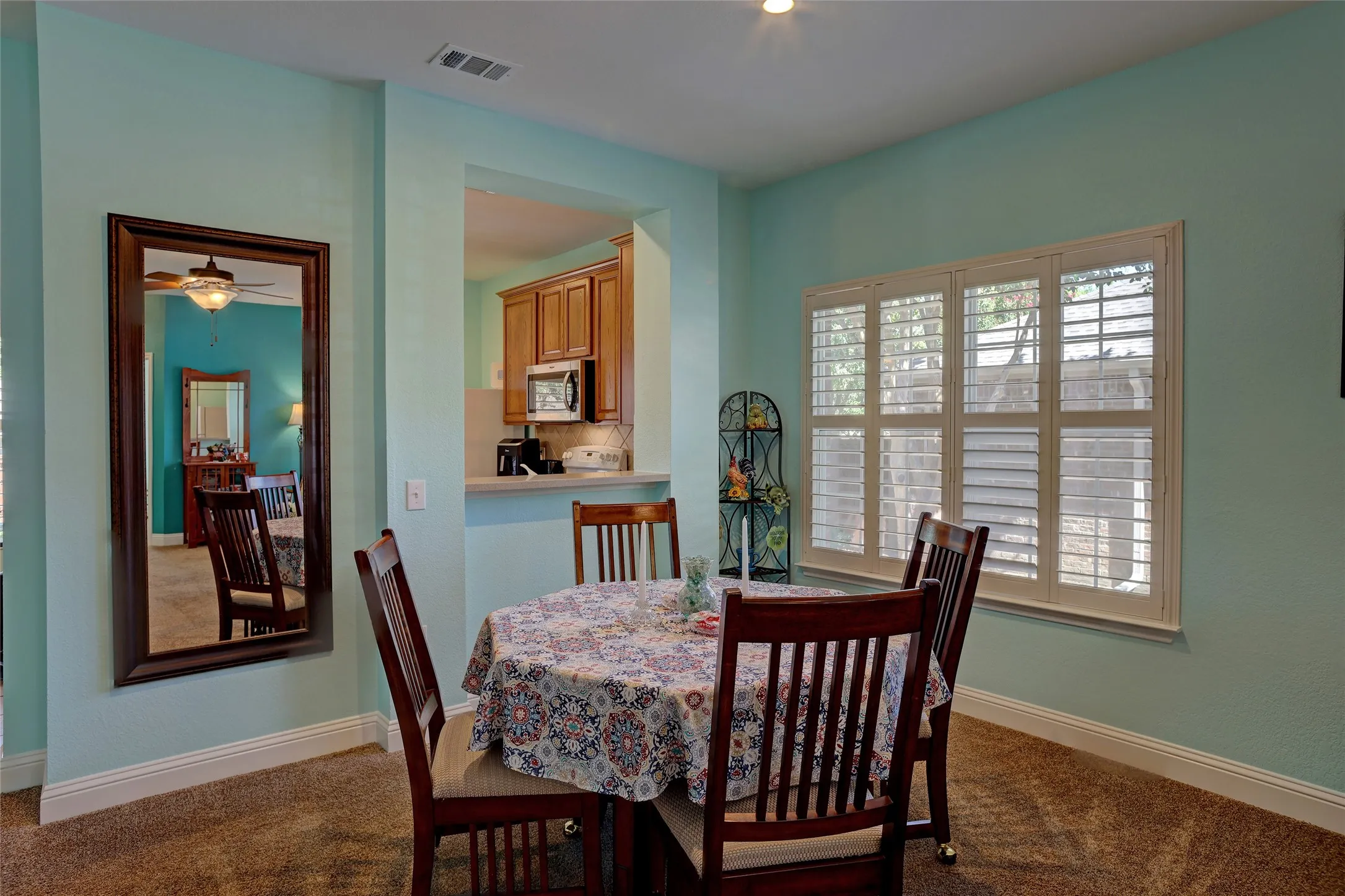 Dining area with open bar into the kitchen