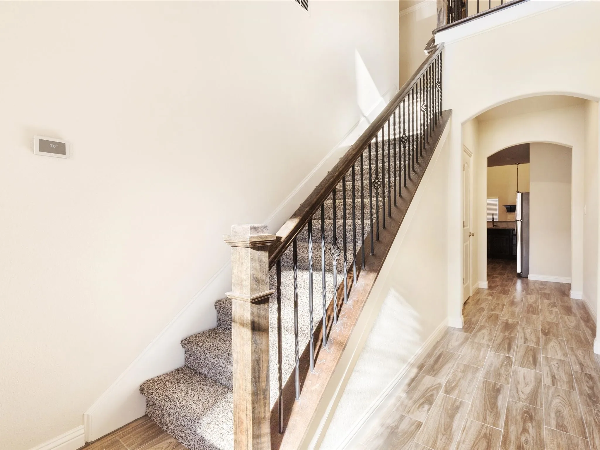 hallway to the upstairs or to half bath or kitchen