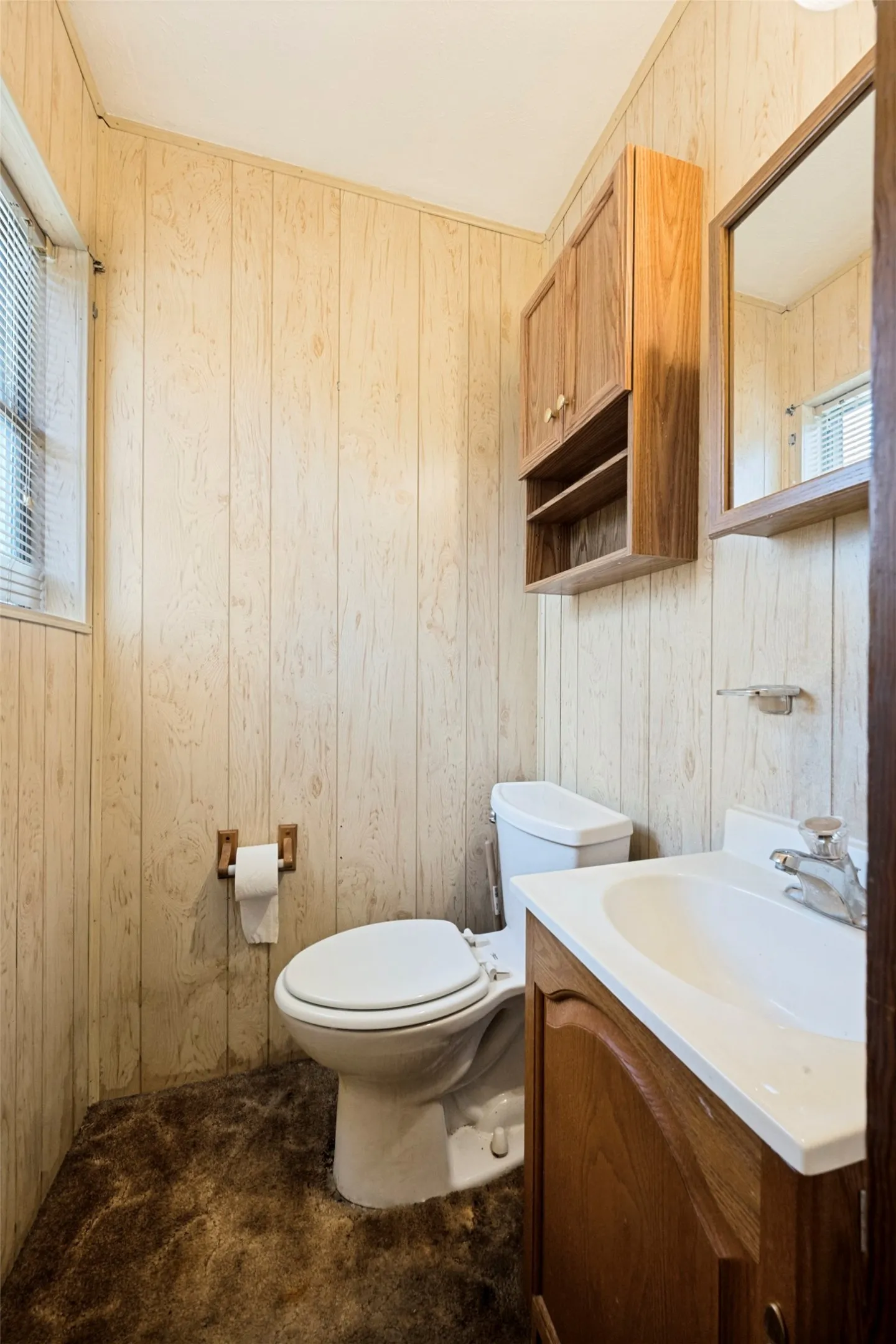 Primary bedroom with attached half bath