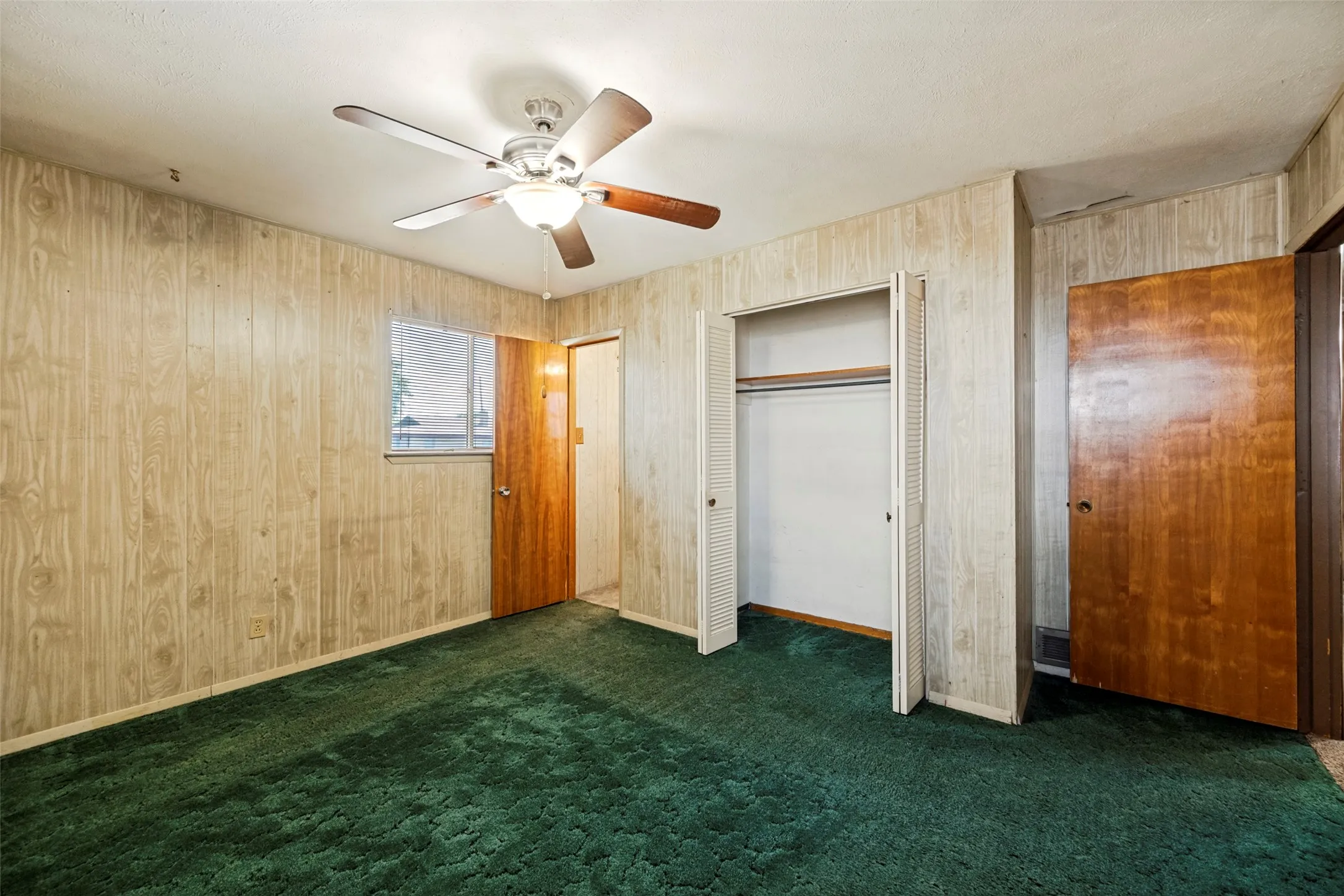 Primary bedroom with attached half bath