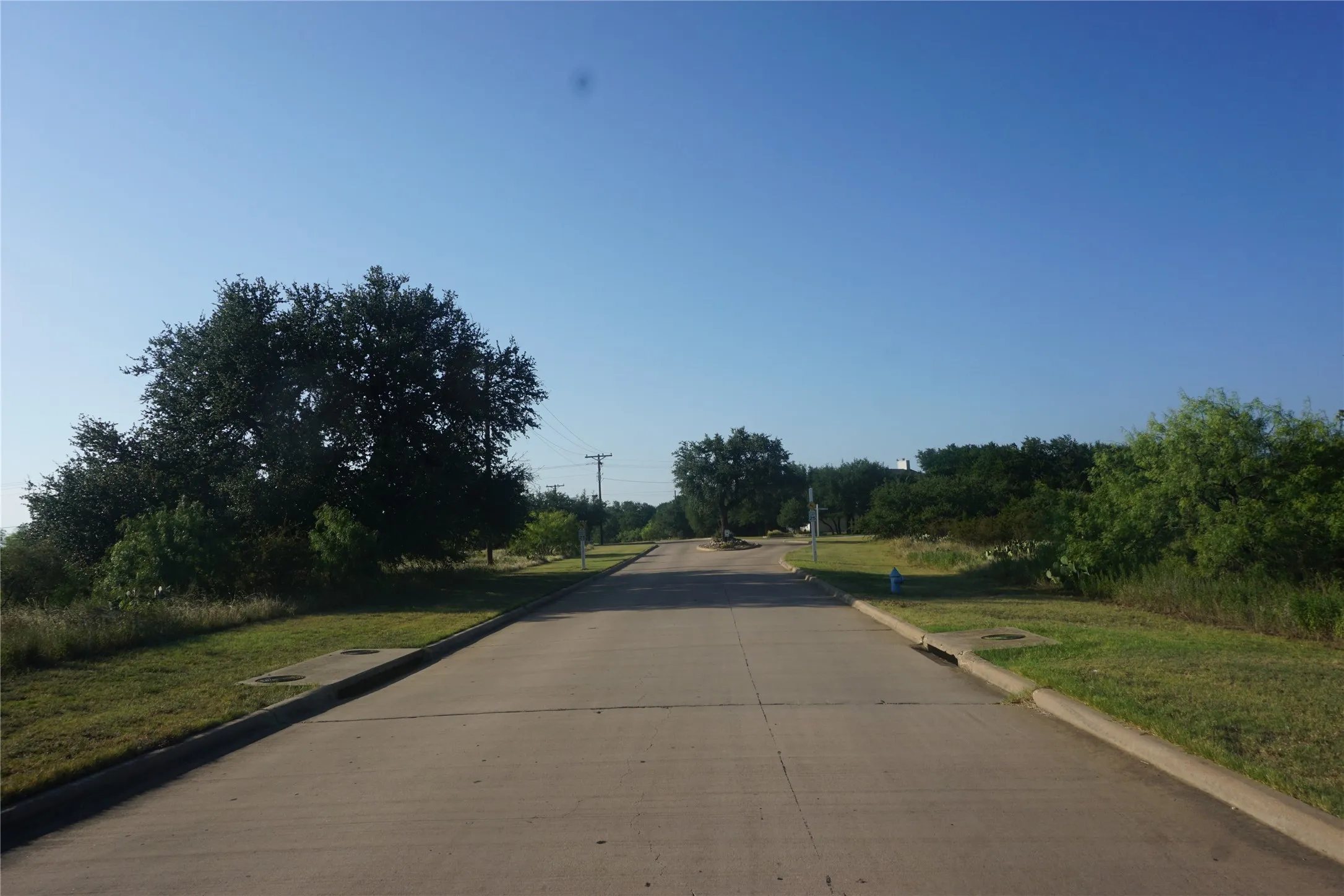 Lot is on the left with the big tree.  You will see a tree in the middle of the road as you drive down Cliffs Drive when entering the development.
