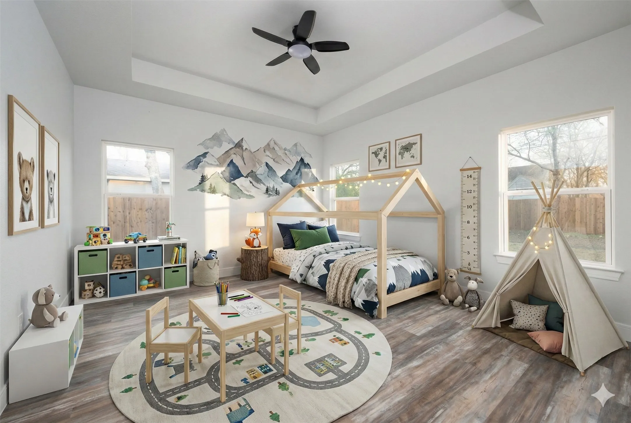 Spacious room featuring wood-finish flooring and a tray ceiling