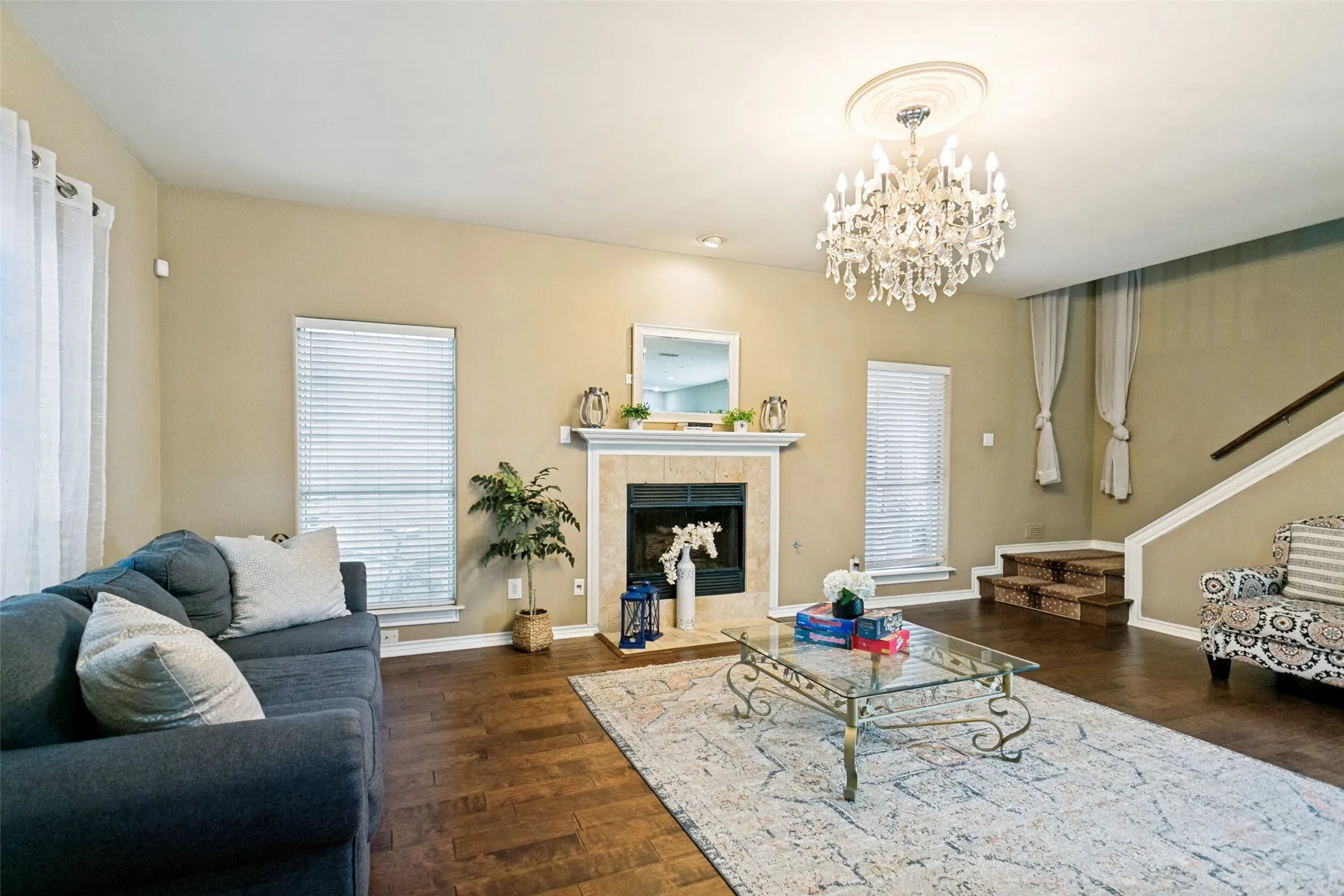 Bright and spacious living room with soaring ceiling and abundant natural light.