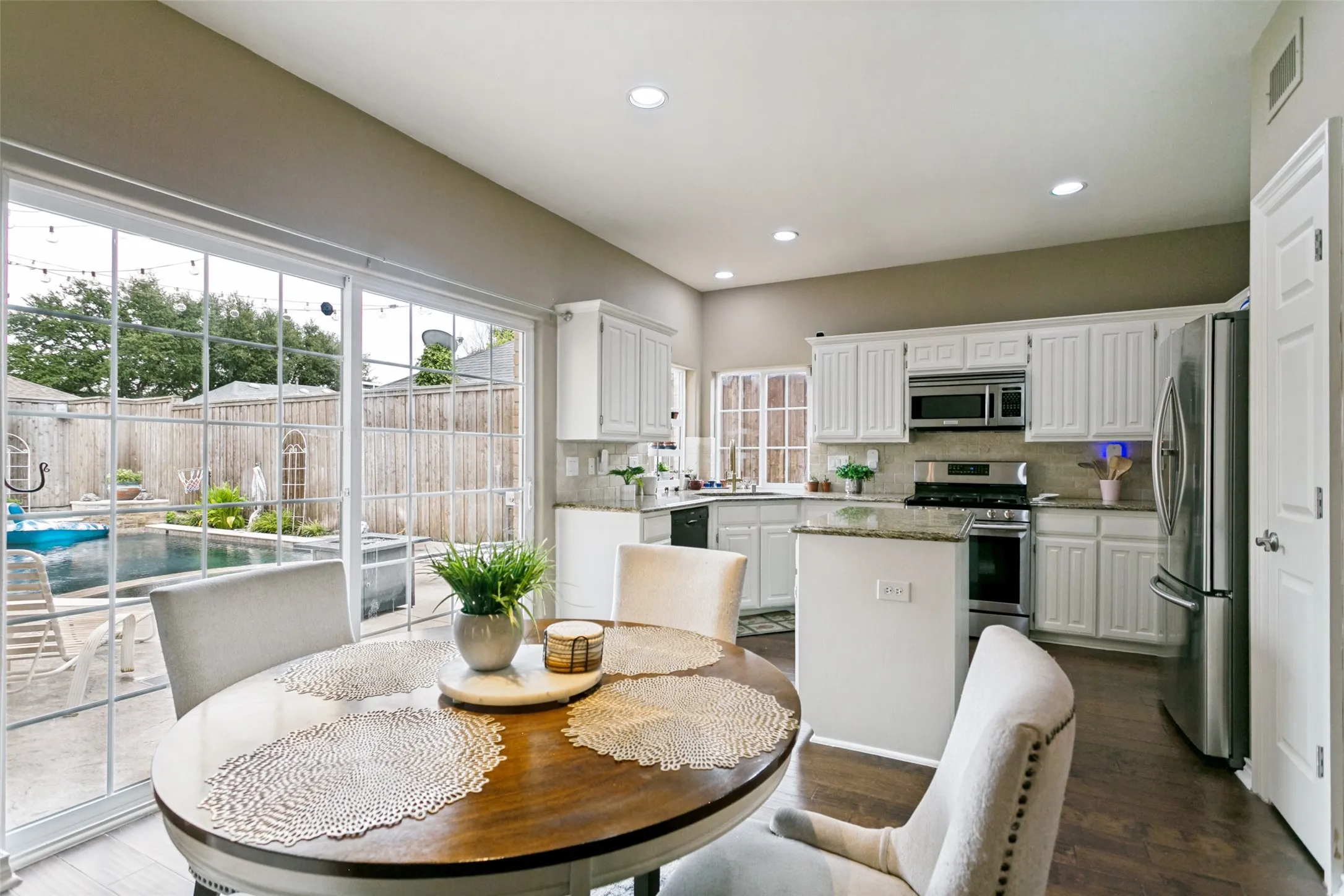 Cozy breakfast area overlooking the backyard and pool.