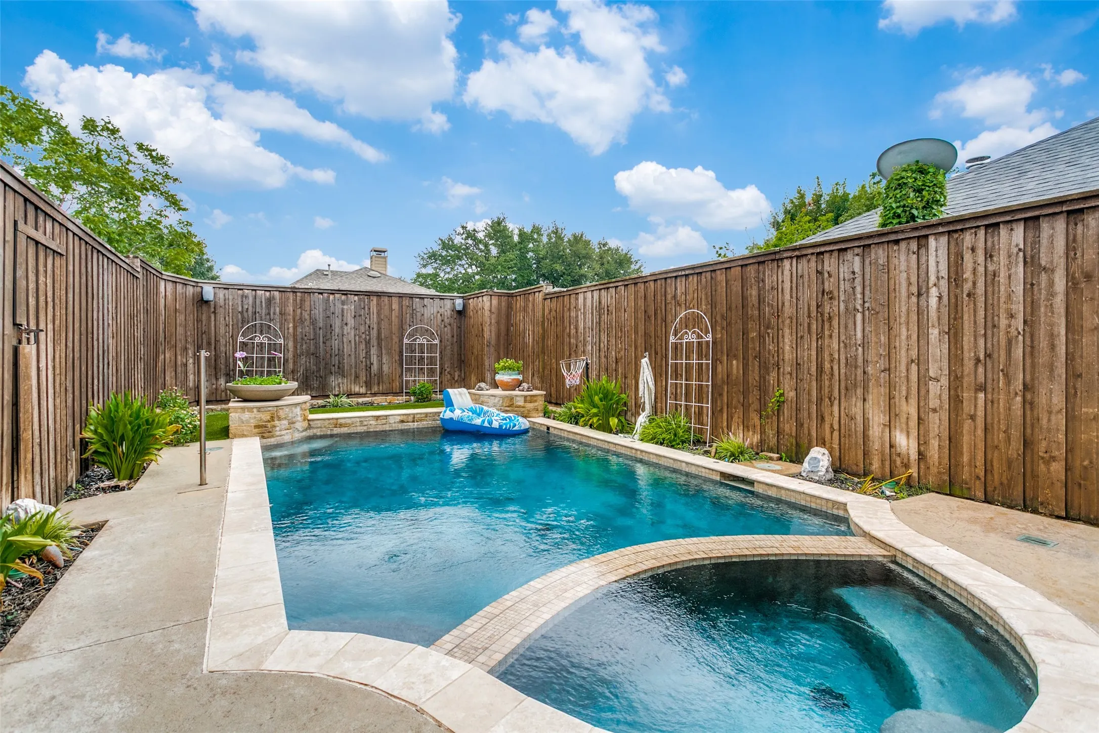 Private backyard with sparkling swimming pool and plenty of outdoor space.
