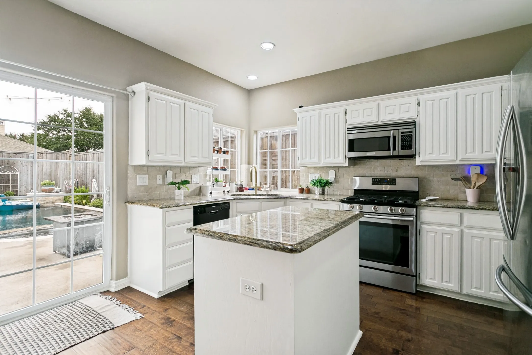 Updated kitchen with granite countertops, stainlless steel appliances and ample cabinet space