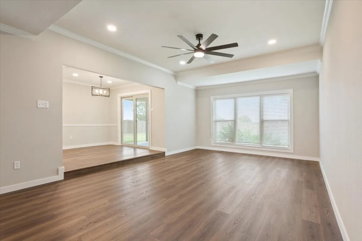 Luxury vinyl plank flooring throughout, here you are looking from the living room looking into dining area