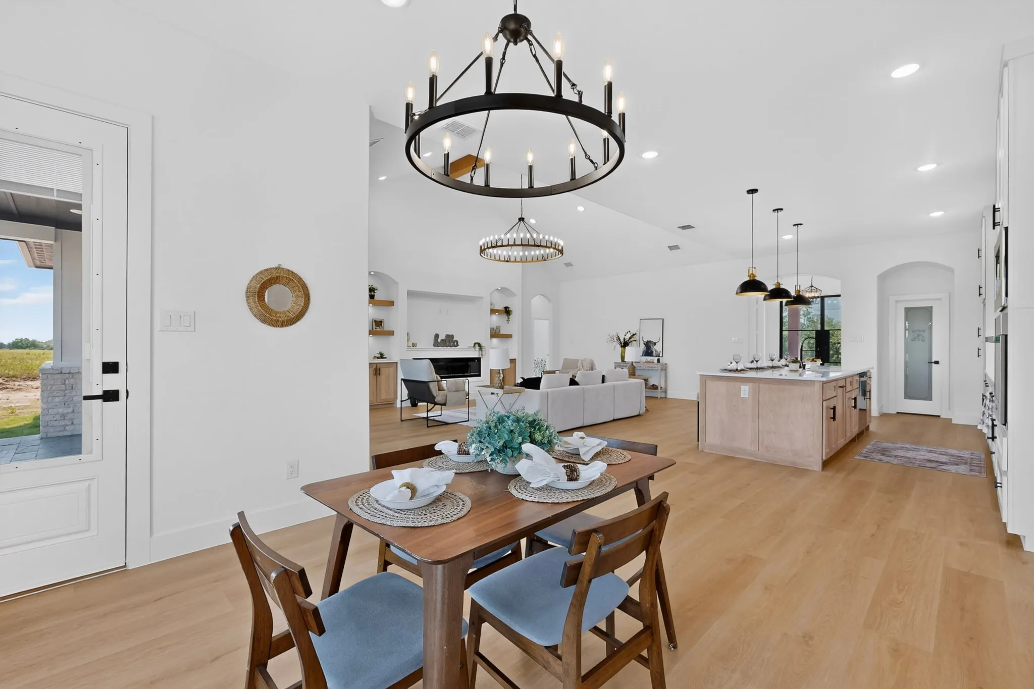 Open-concept interior featuring light wood-finish flooring throughout