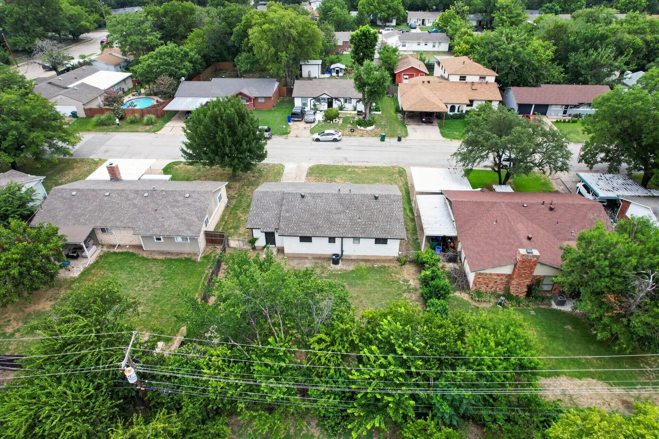 Expansive residential property featuring a large backyard and mature landscaping