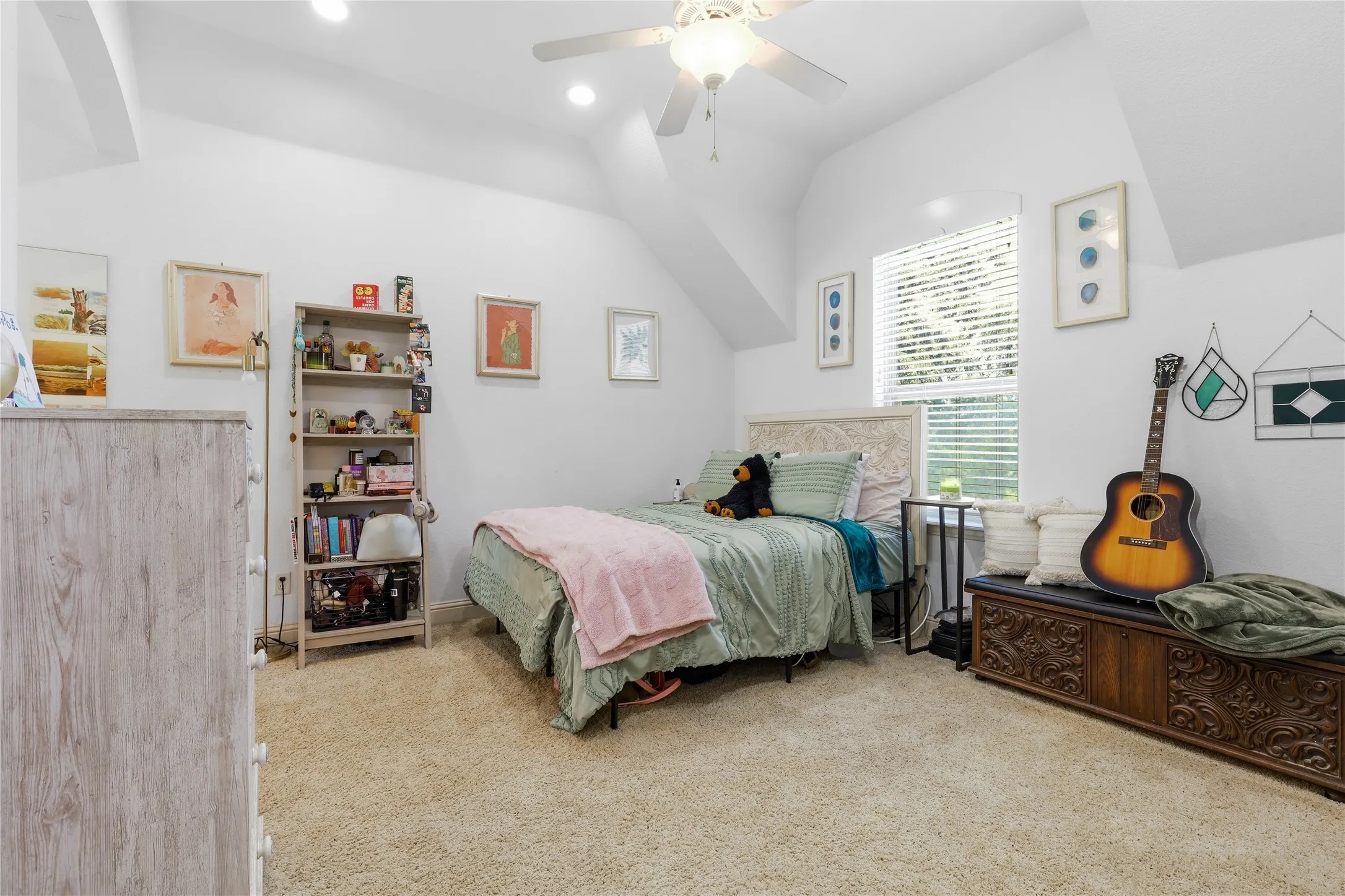 Carpeted room featuring a ceiling fan, recessed lighting, and a single window with blinds