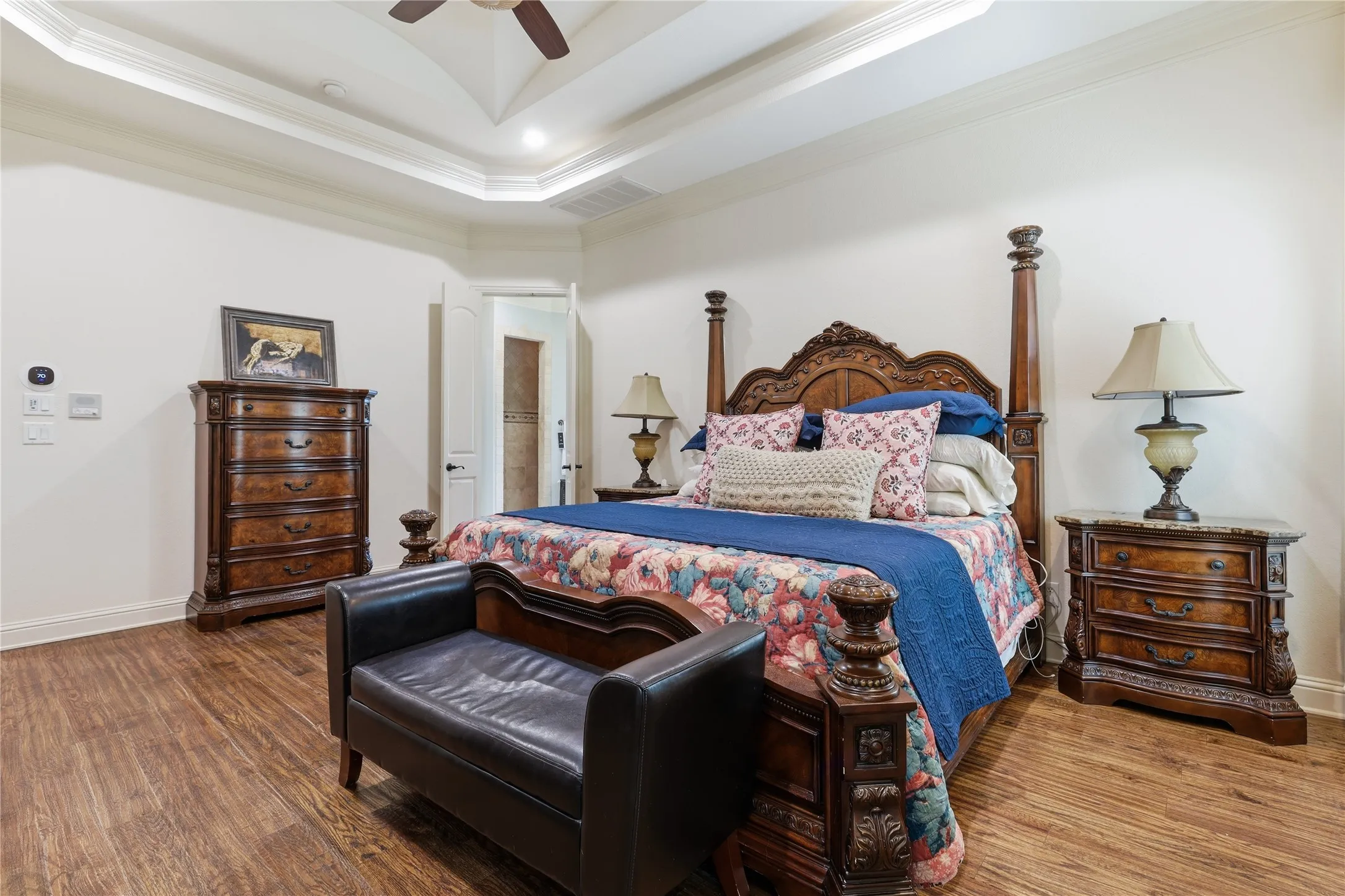 Tray ceiling with recessed lighting and a ceiling fan