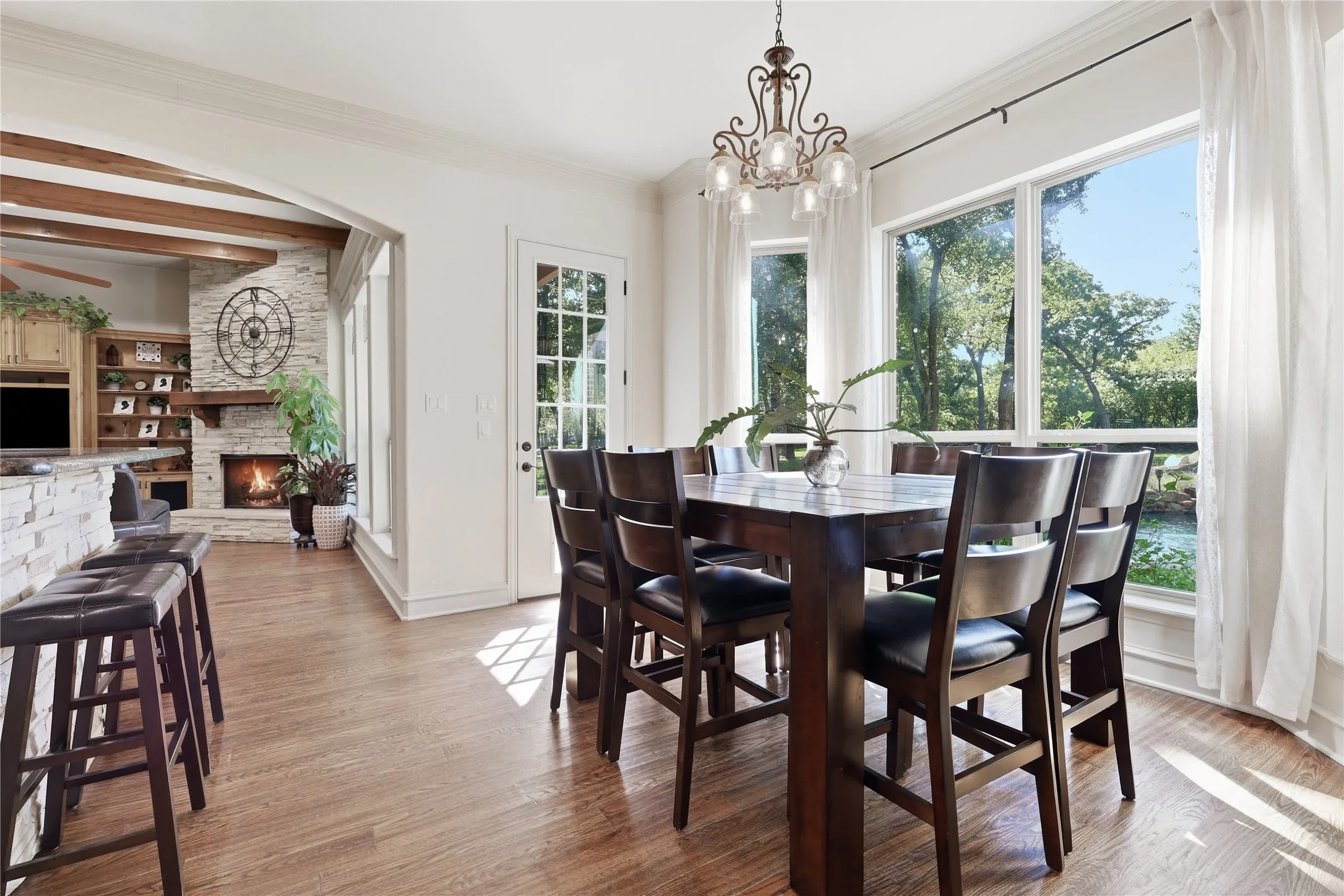 Dining area featuring wood-finish flooring and a multi-pane glass door