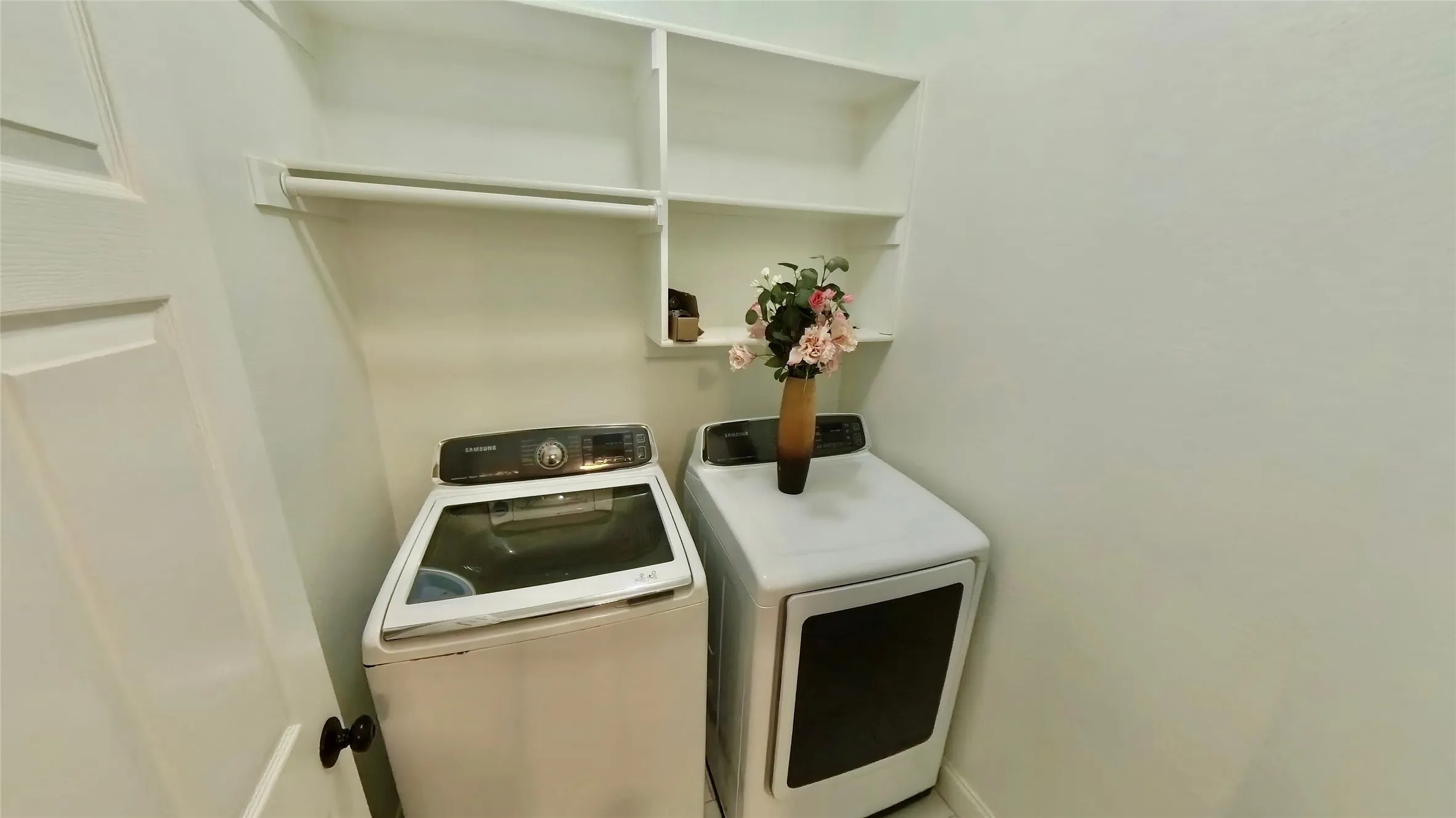 Clothes washing area featuring separate washer and dryer