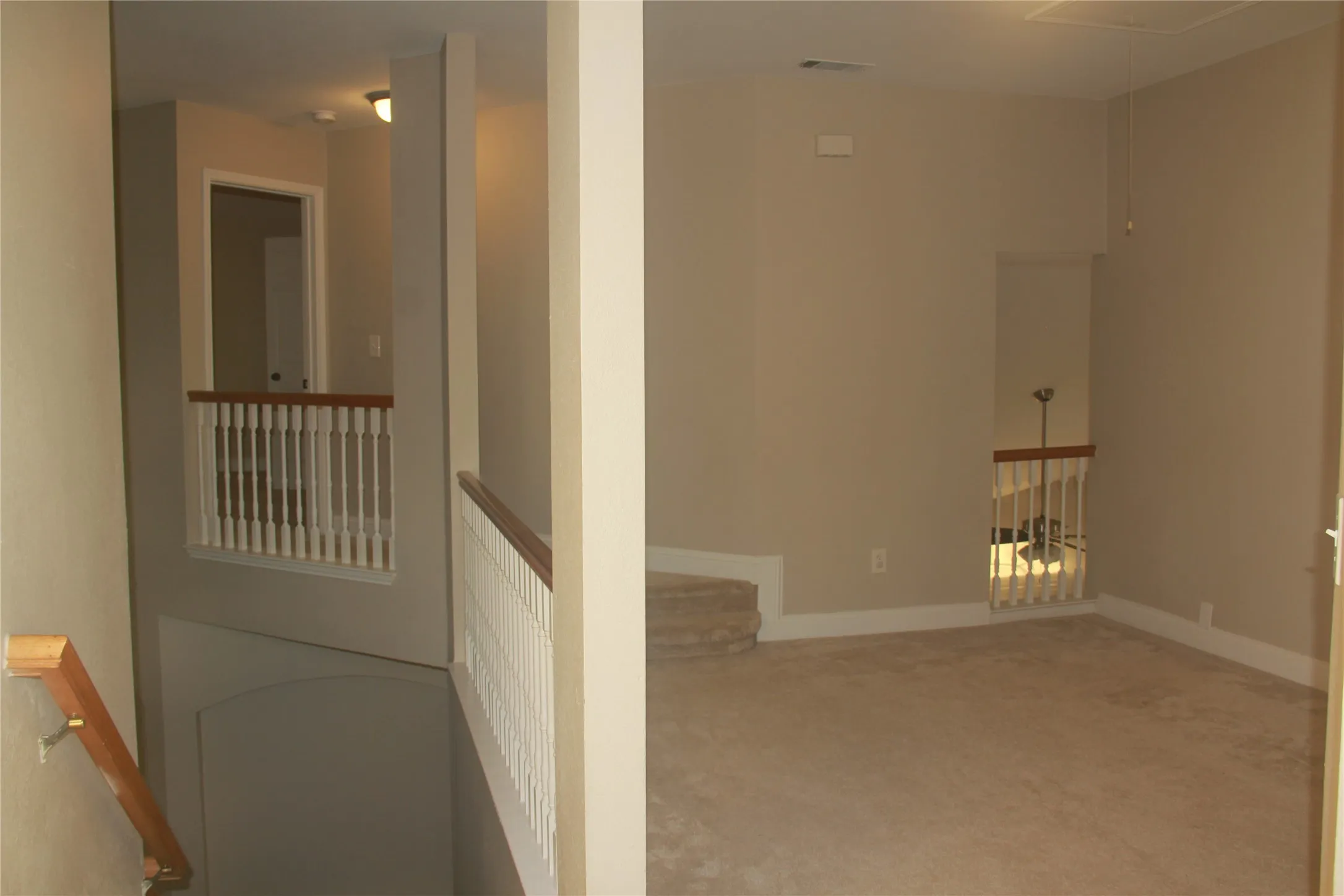 Hallway with carpet flooring