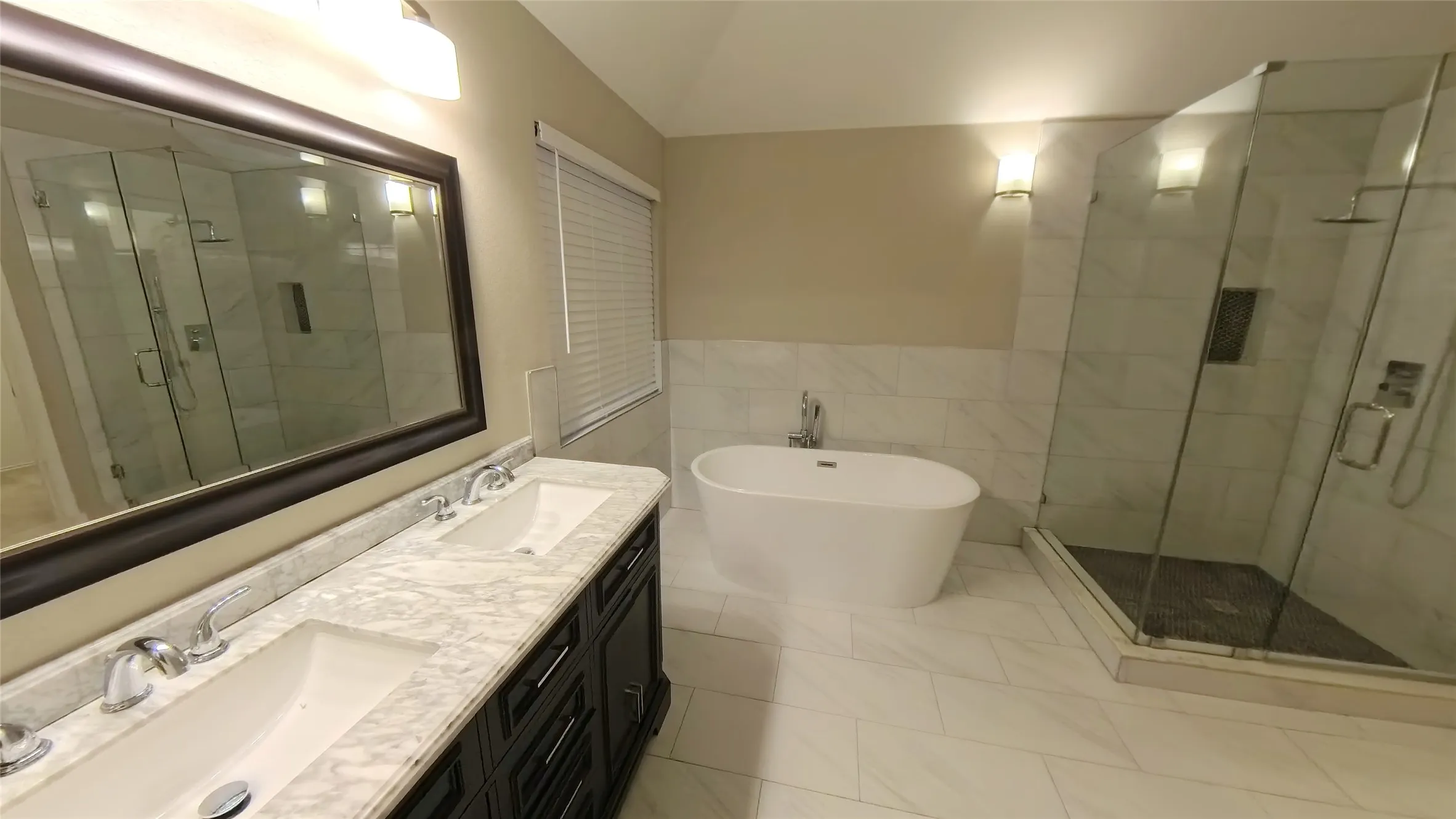 Bathroom featuring vanity, tile walls, tile patterned flooring, shower with separate bathtub, and lofted ceiling