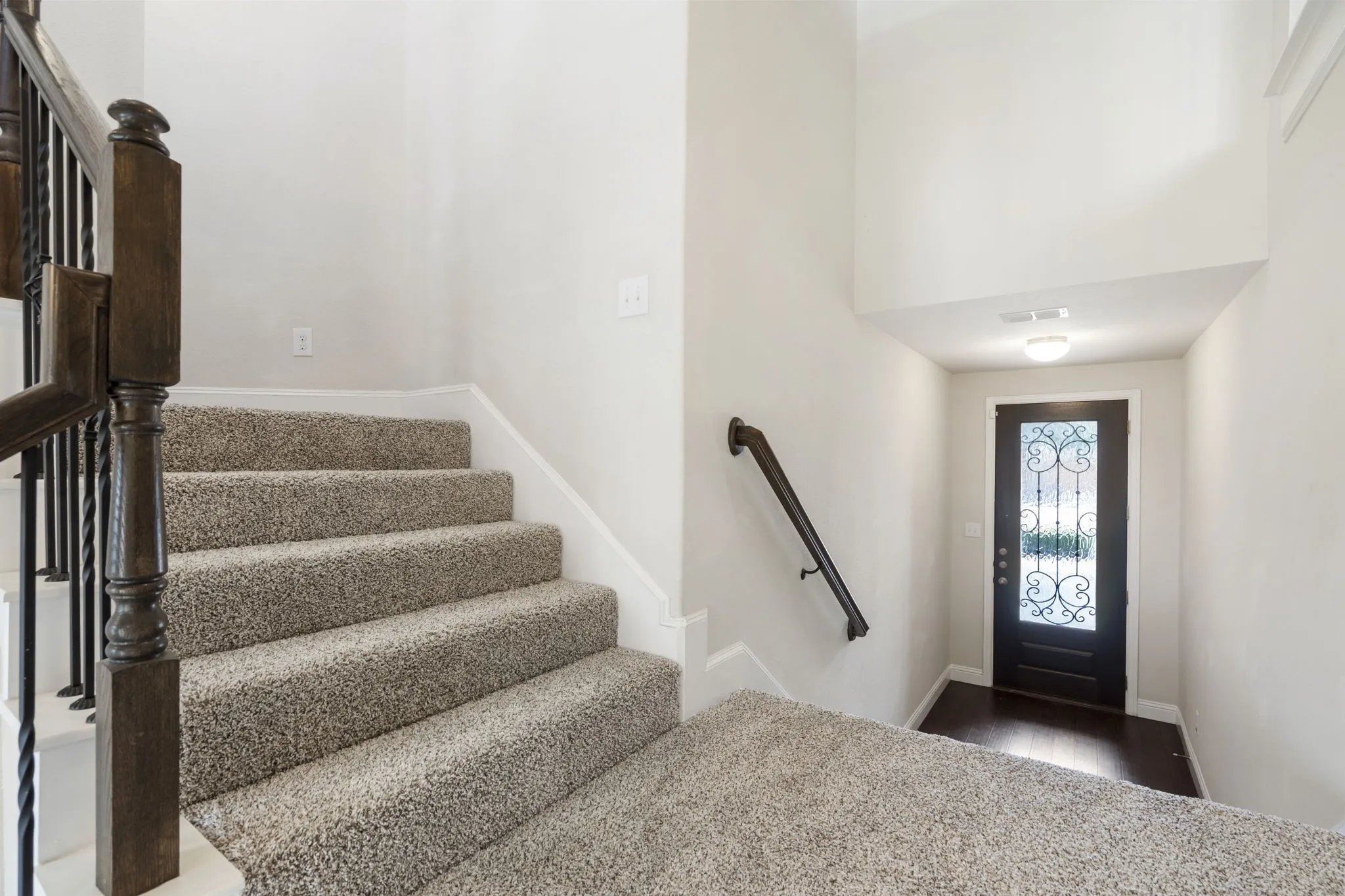 The private entry opens to the extra wide stairs.
