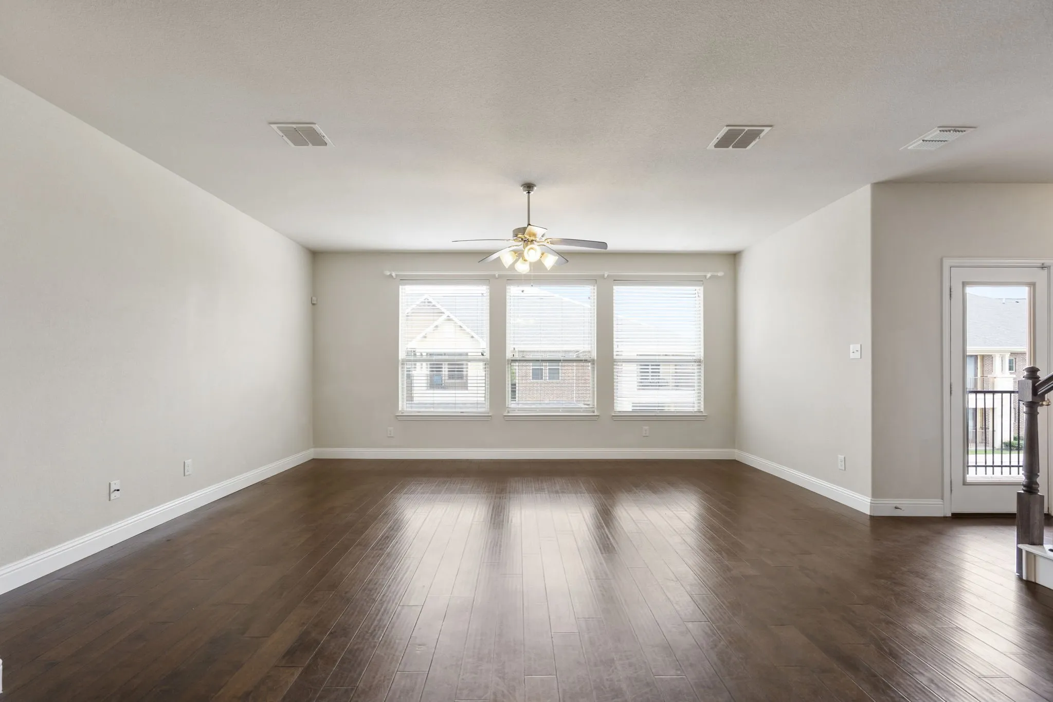 A view of the Great Room from the kitchen showing the bright windows!