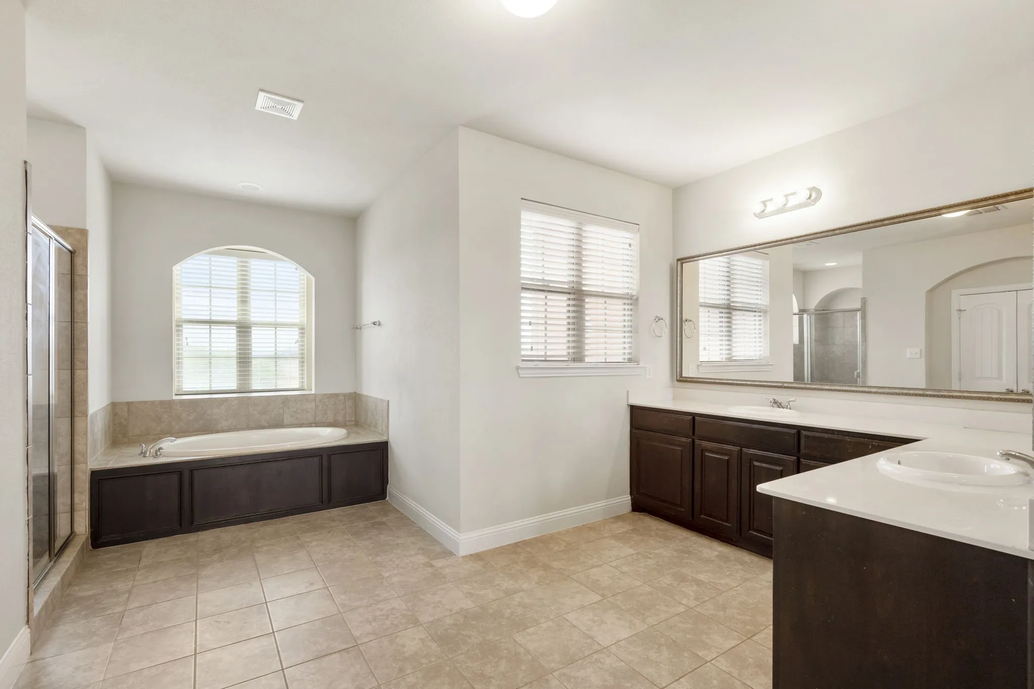 The primary bathroom is simply too large for just two people!