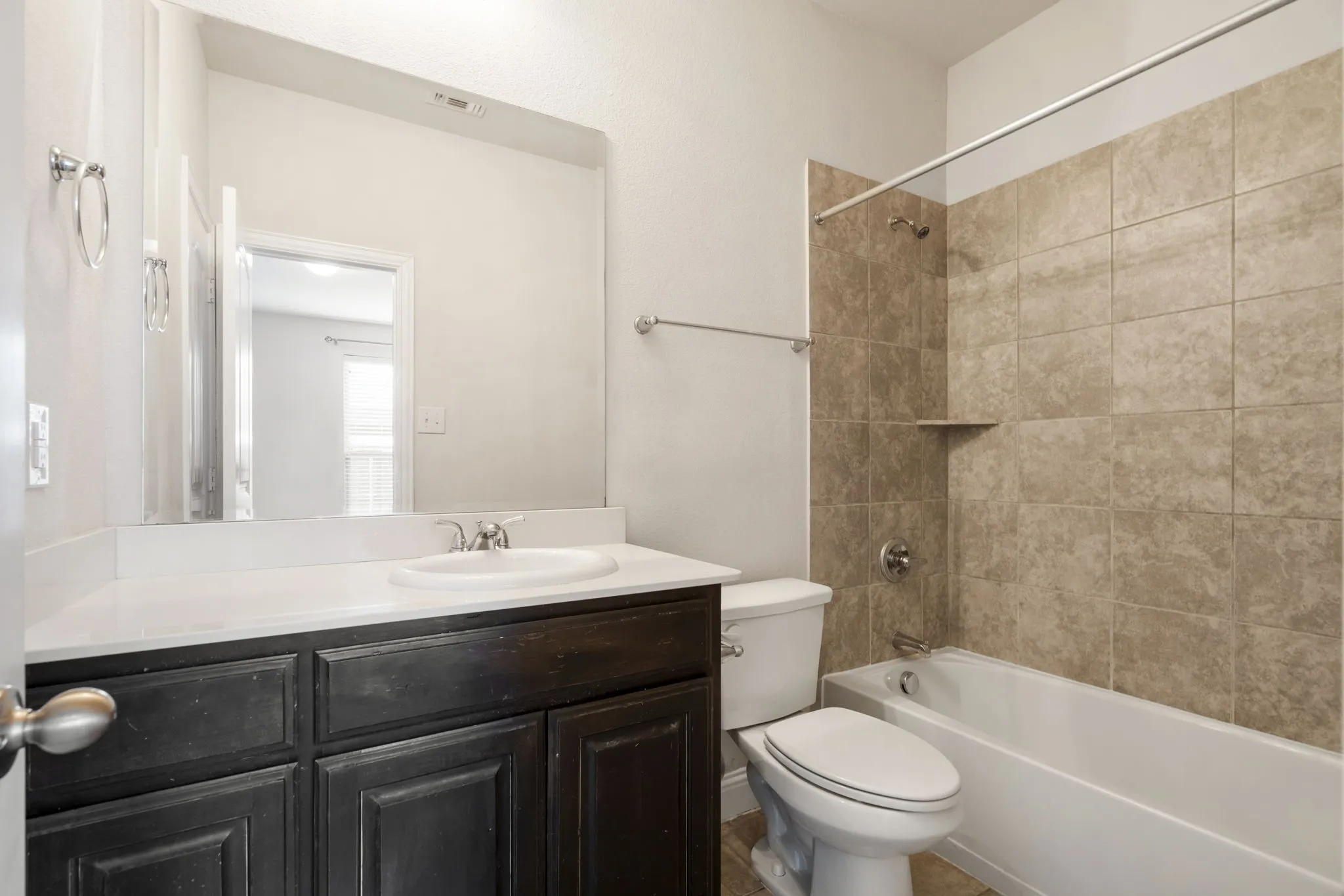 The bathroom on the first floor is attached to the bedroom.