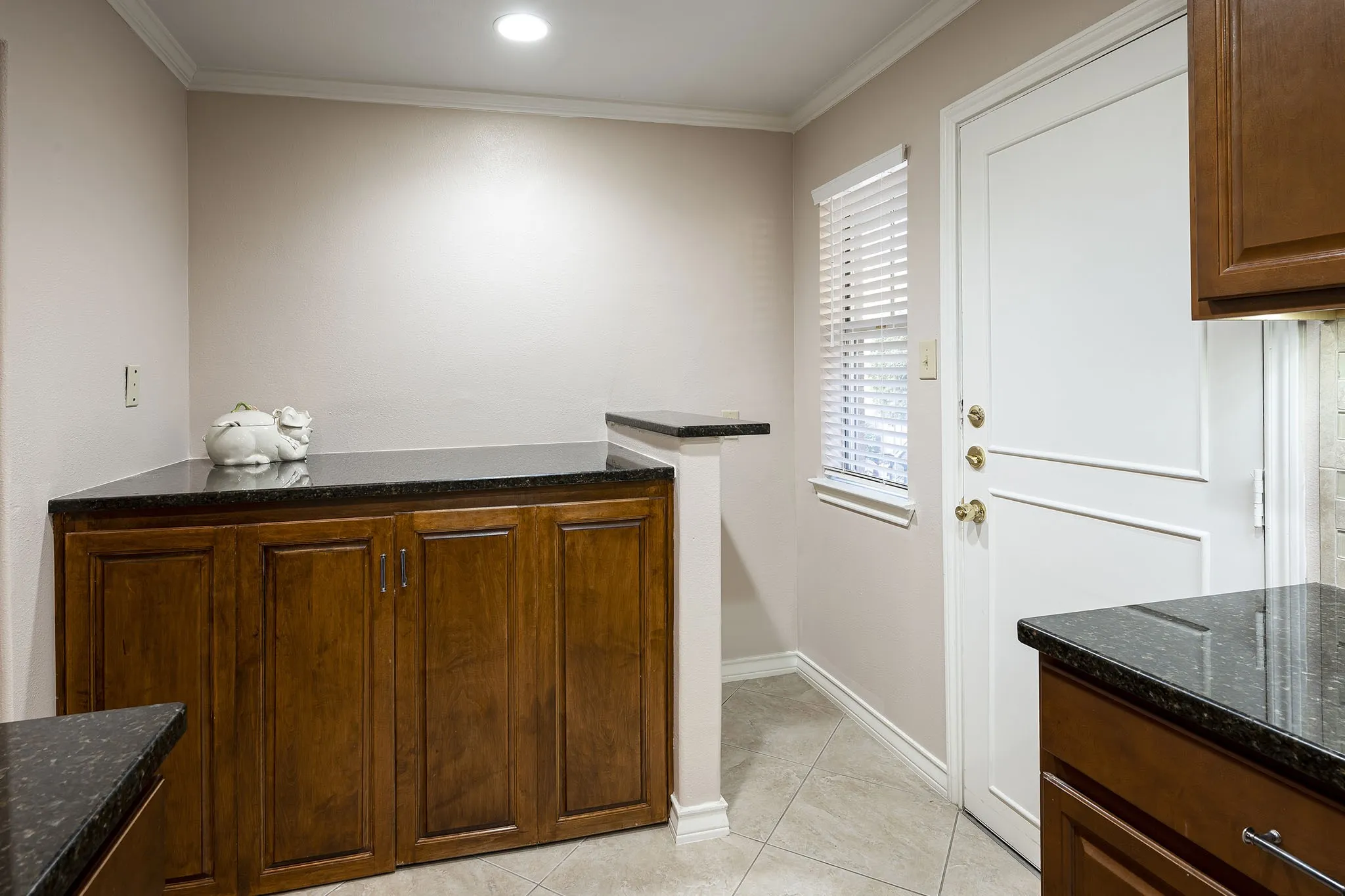 Large living room with beautiful wood floors, crown molding and plenty of natural light