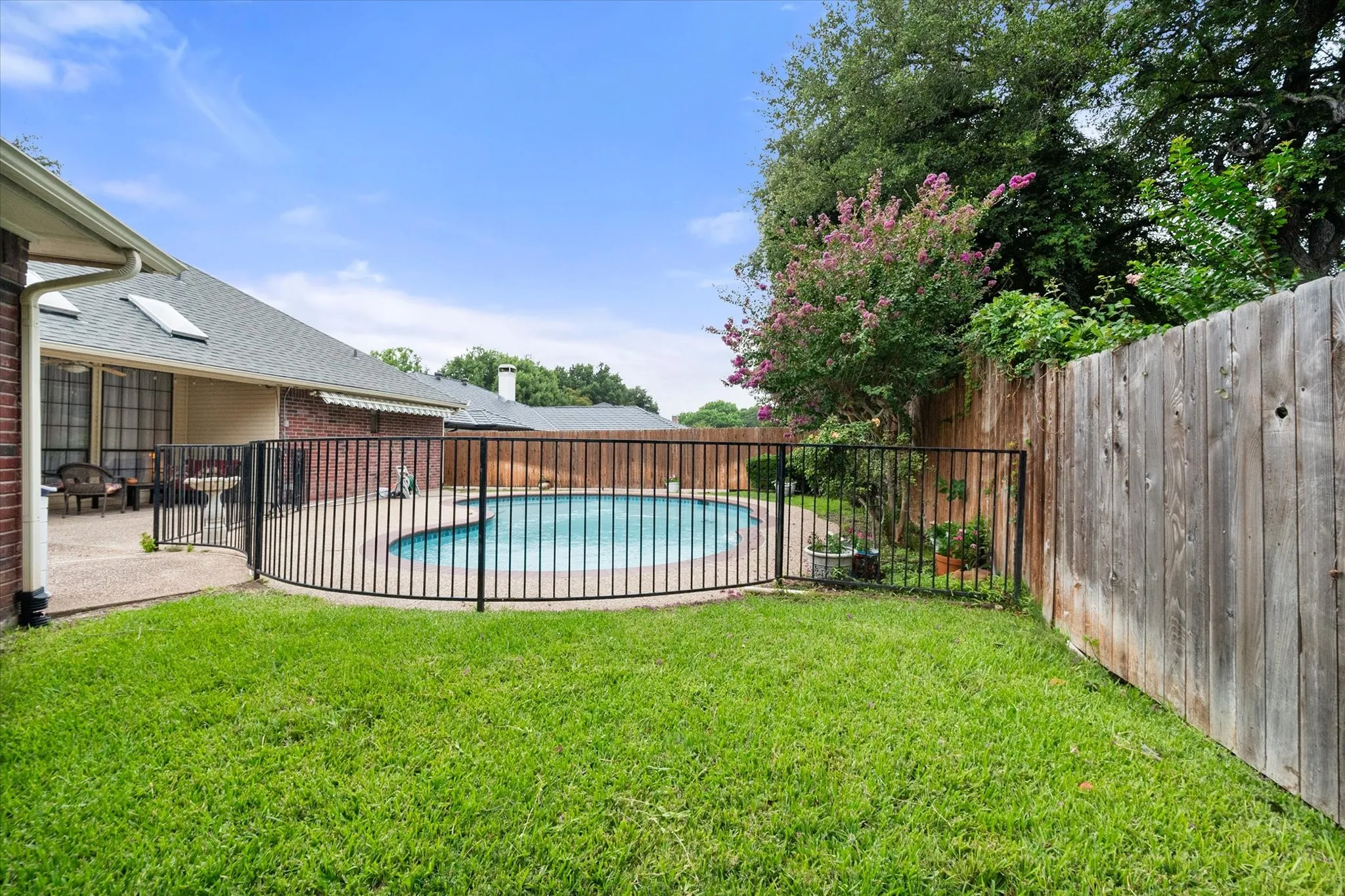 View of the pool with separate iron safety fence