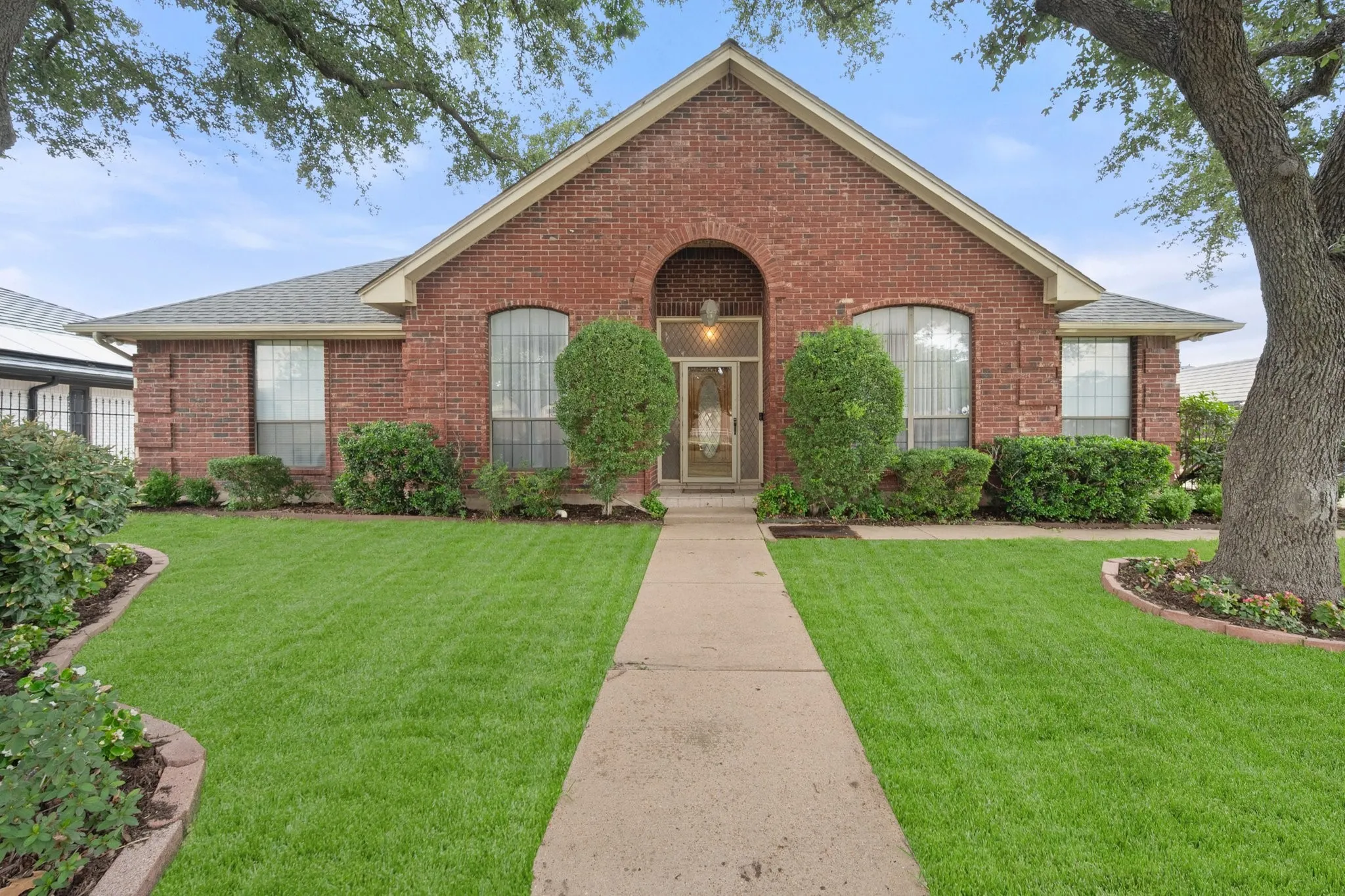 Grass has been digitally enhanced to illustrate seasonal lawn appearance.
