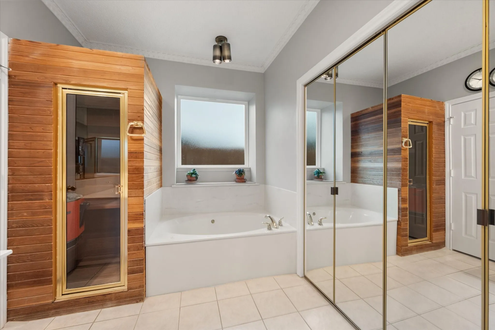 Dry sauna, garden tub, and mirrored, spacious double closets