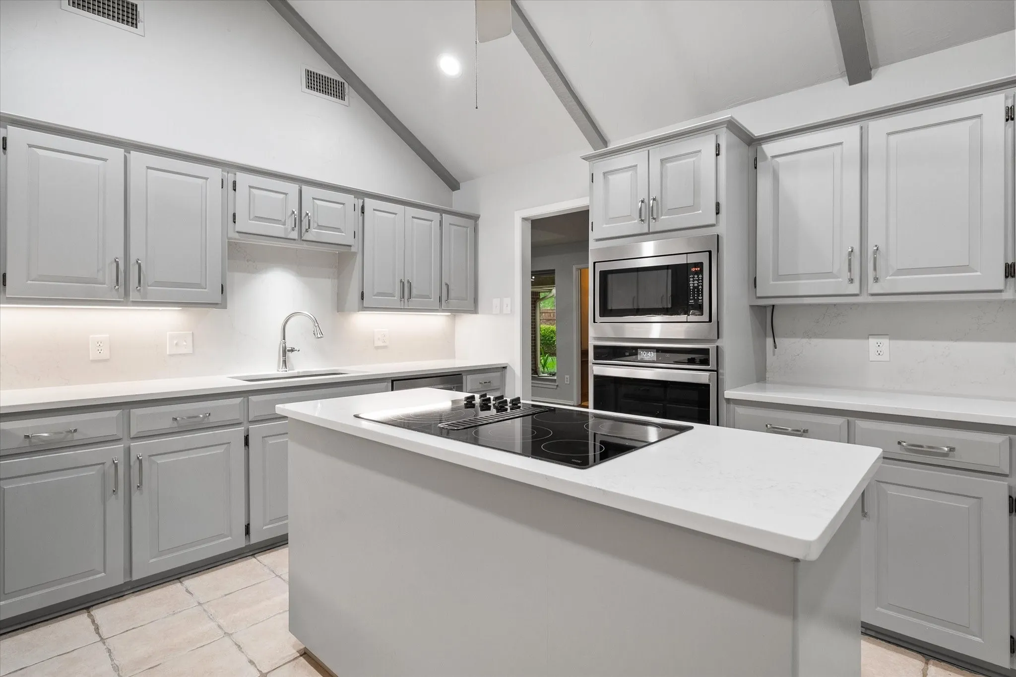 Kitchen w/ Island and Quartz counter tops