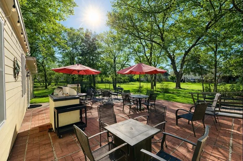 outdoor cooking area.  Includes a detached grill and sink that can remain with the home