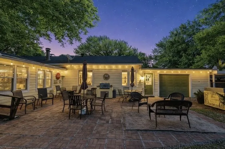 outdoor cooking area.  Includes a detached grill and sink that can remain with the home