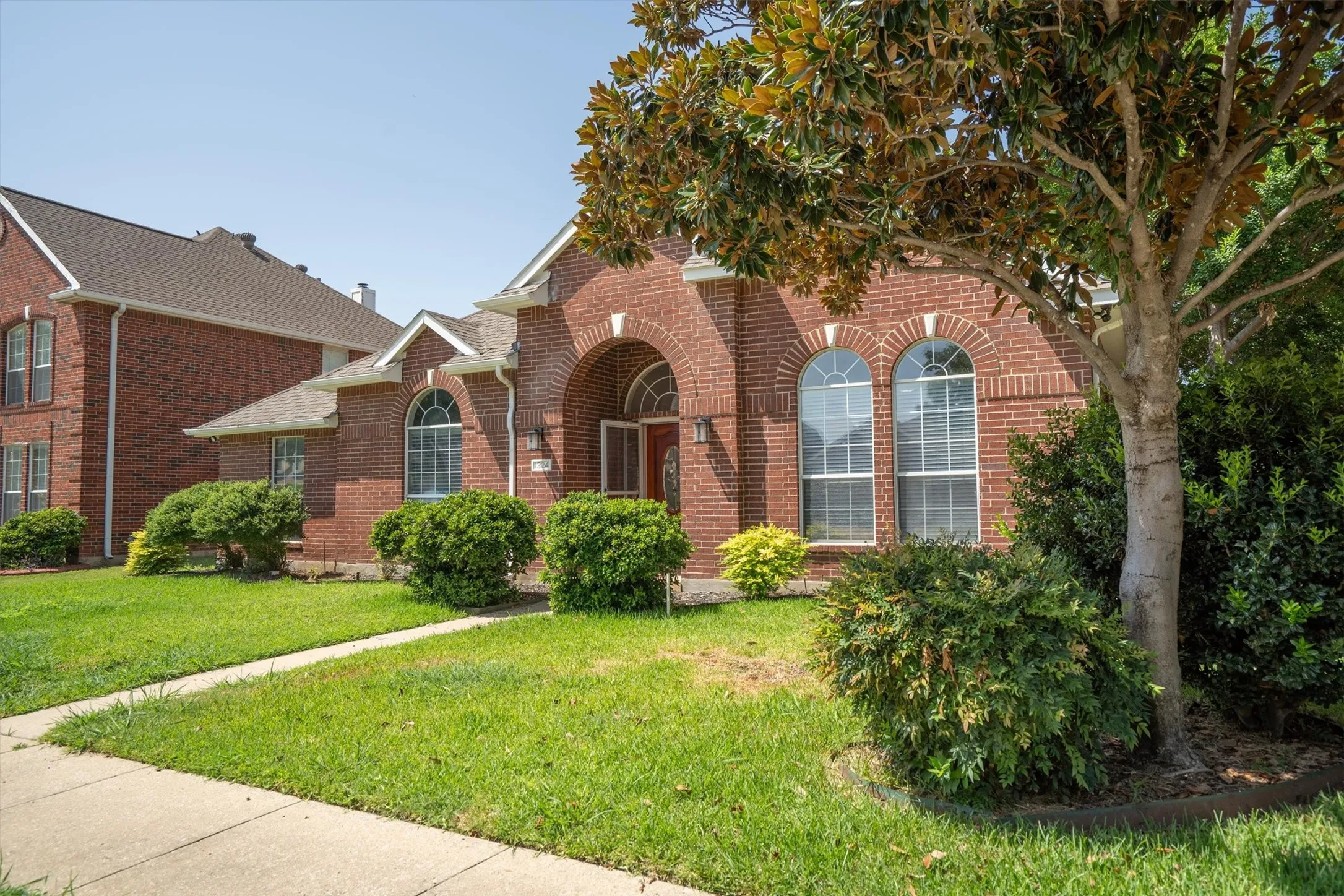 Brick exterior with arched window details