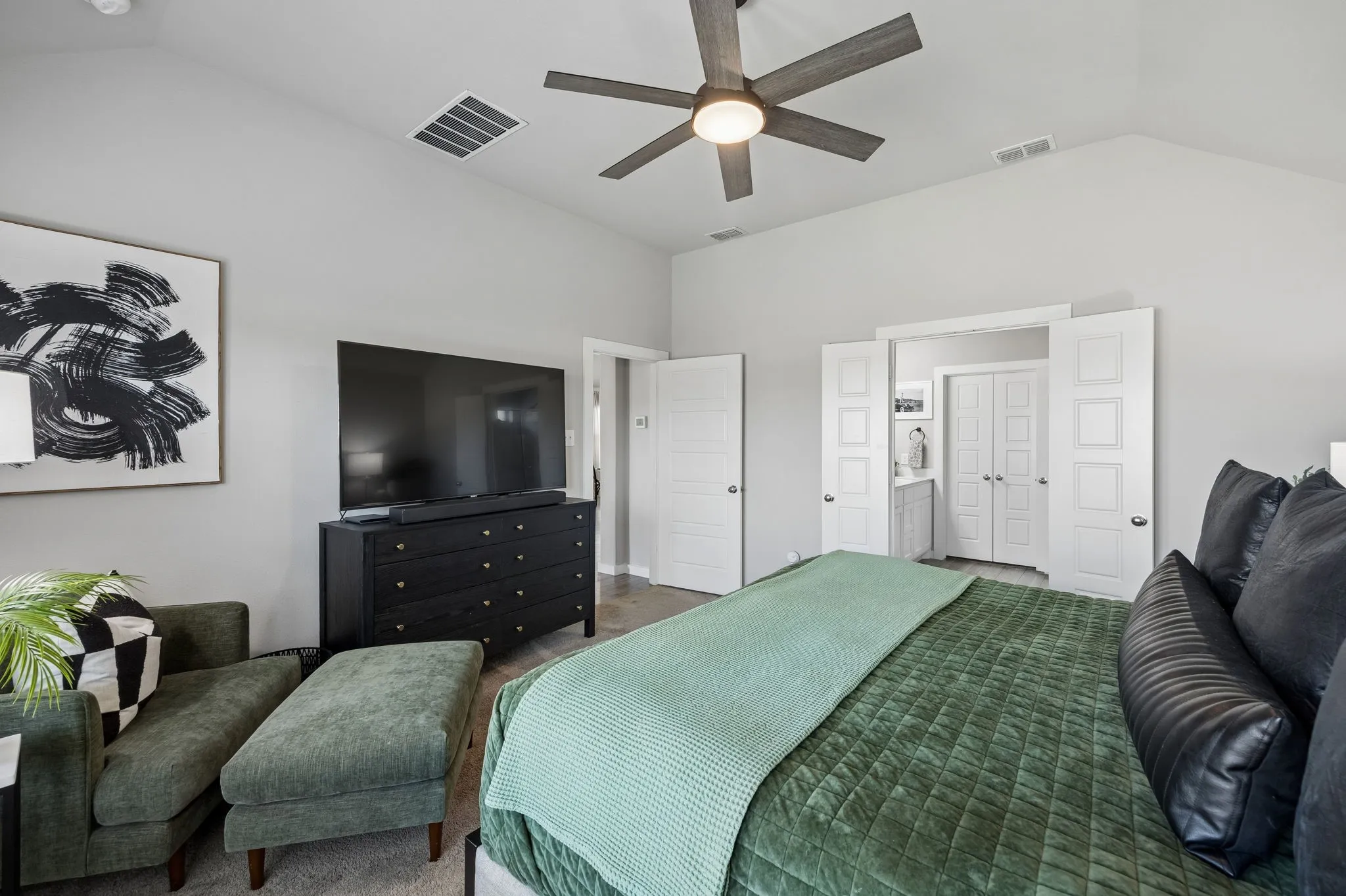 The primary retreat is tucked away at the back of the home for privacy.