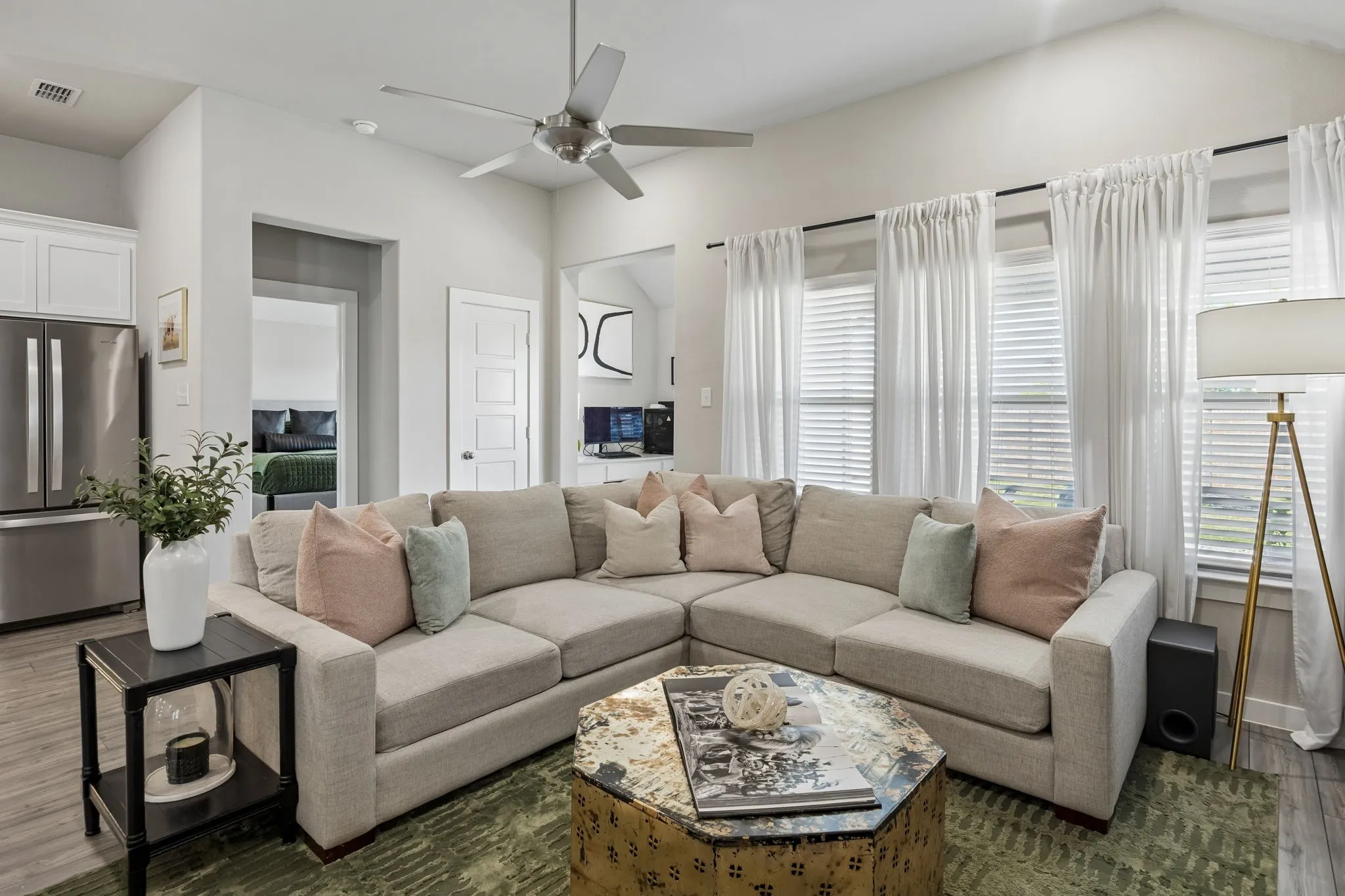 Bright and open living room, perfect for hosting or cozying up on the couch to unwind after a long day.