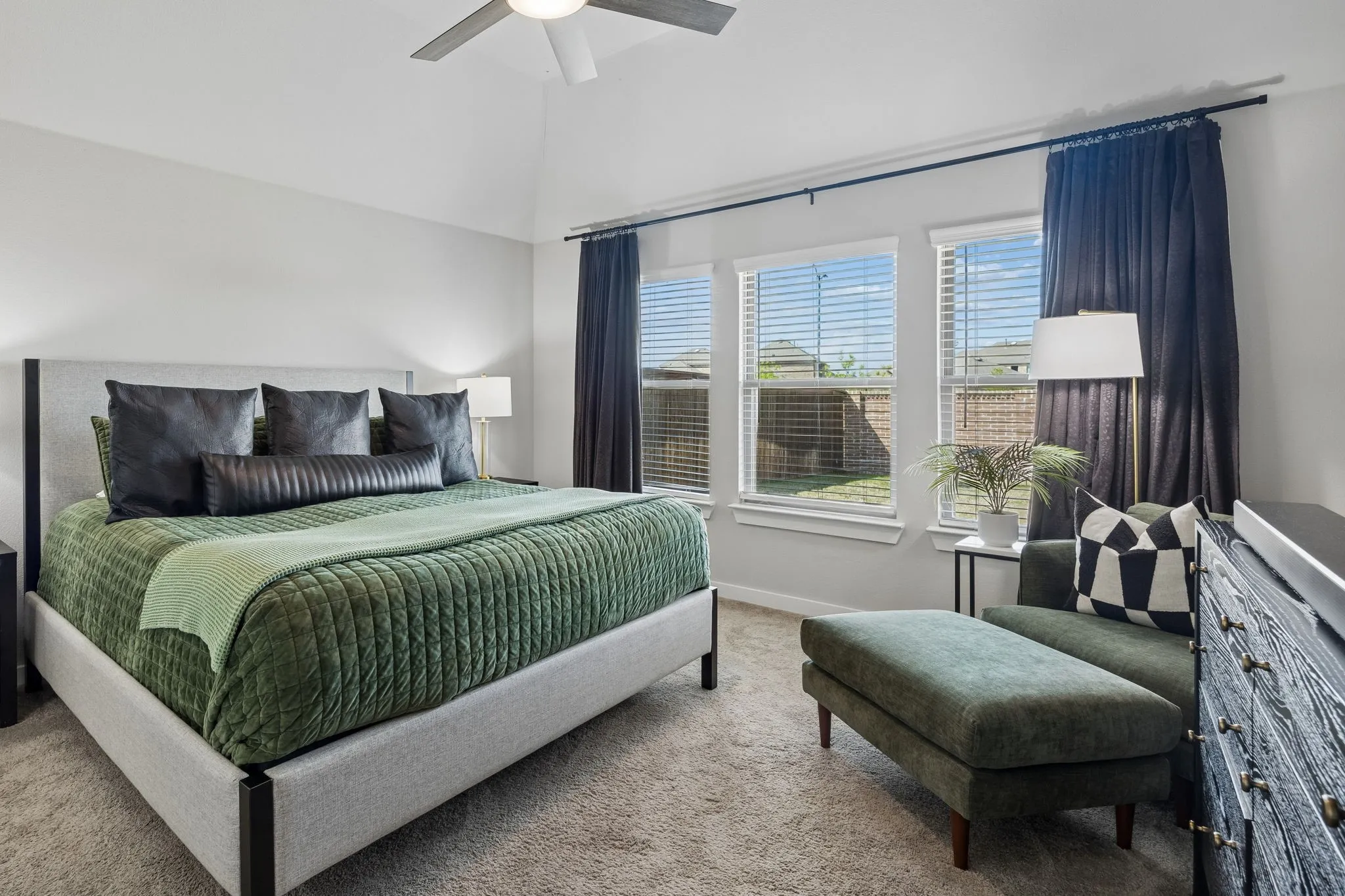 Tranquil primary bedroom. Enjoy the spacious retreat with space for a cozy sitting area-perfect to curl up with a book or enjoy your morning coffee.