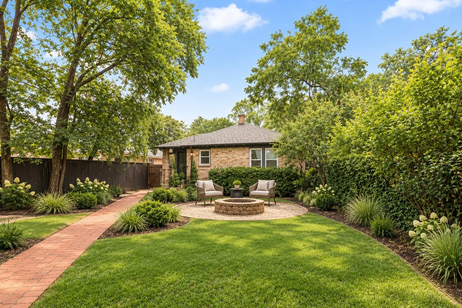 BACKYARD POTENTIAL  - Expansive backyard featuring a manicured lawn, brick paver pathway, gravel patio, and stone-built fire pit
