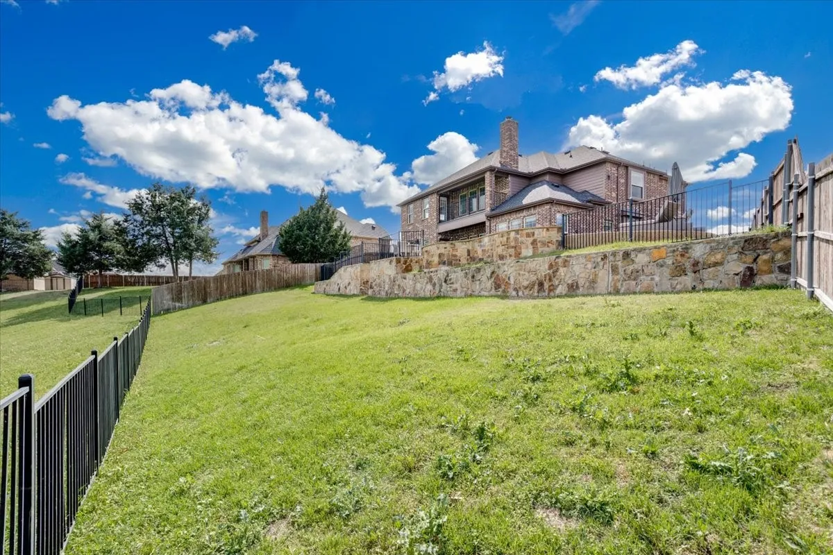 View of fenced backyard