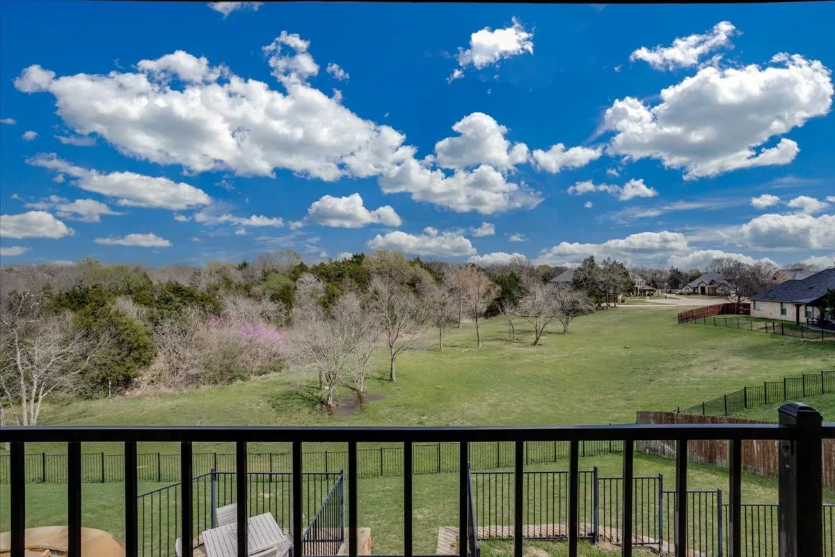 Balcony featuring a view of countryside
