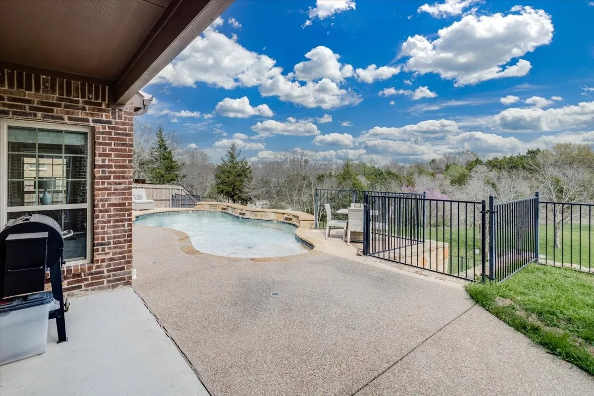 View of pool featuring patio surround