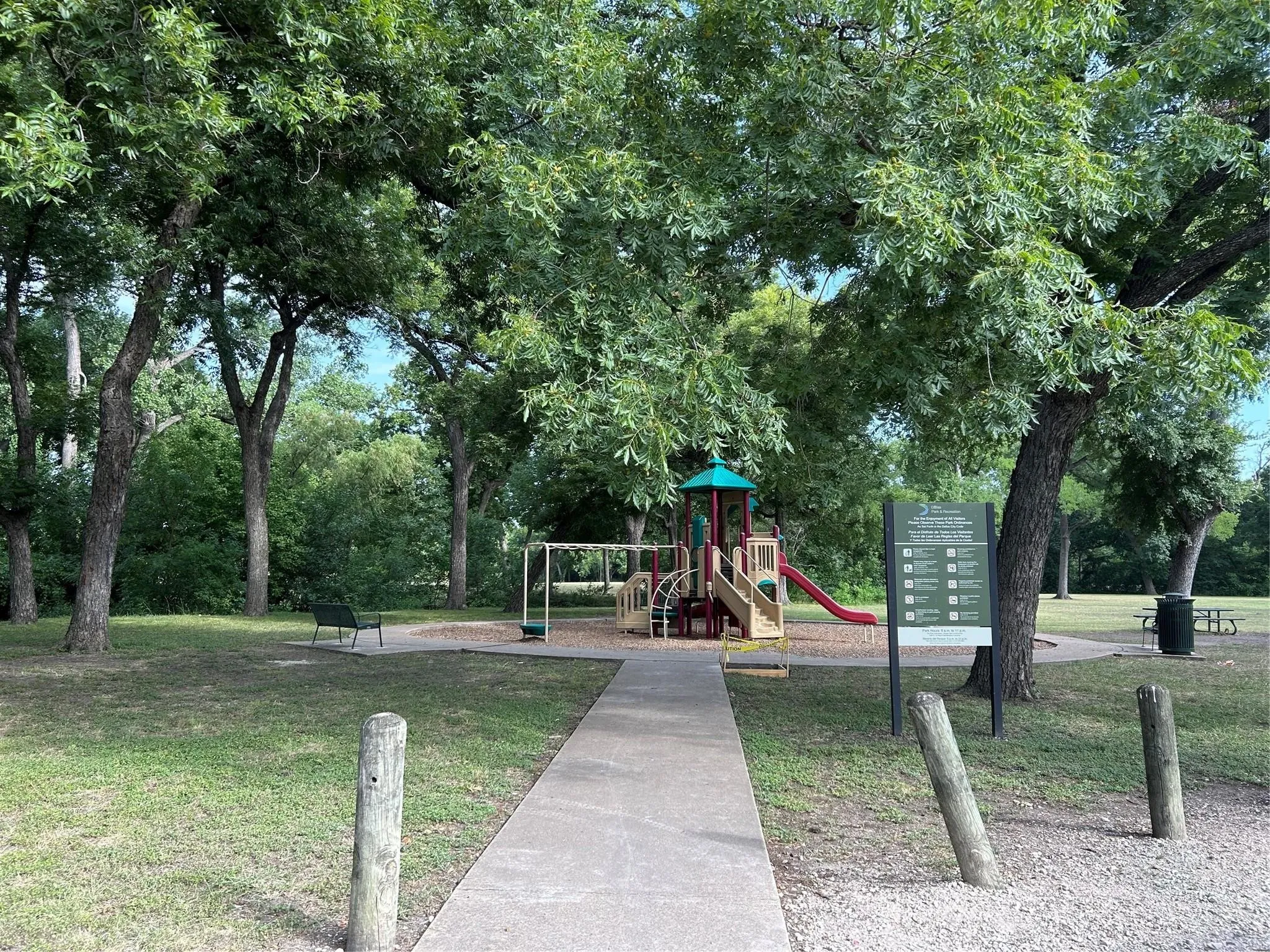Community playground featuring slides, swings, and a multi-level structure