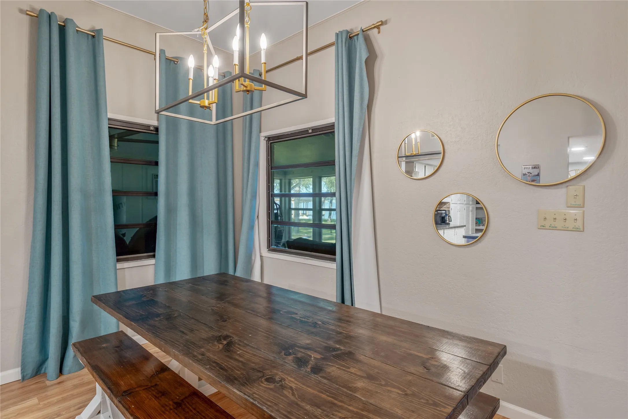 Dining area featuring a dark-stained wood-finish table and bench seating