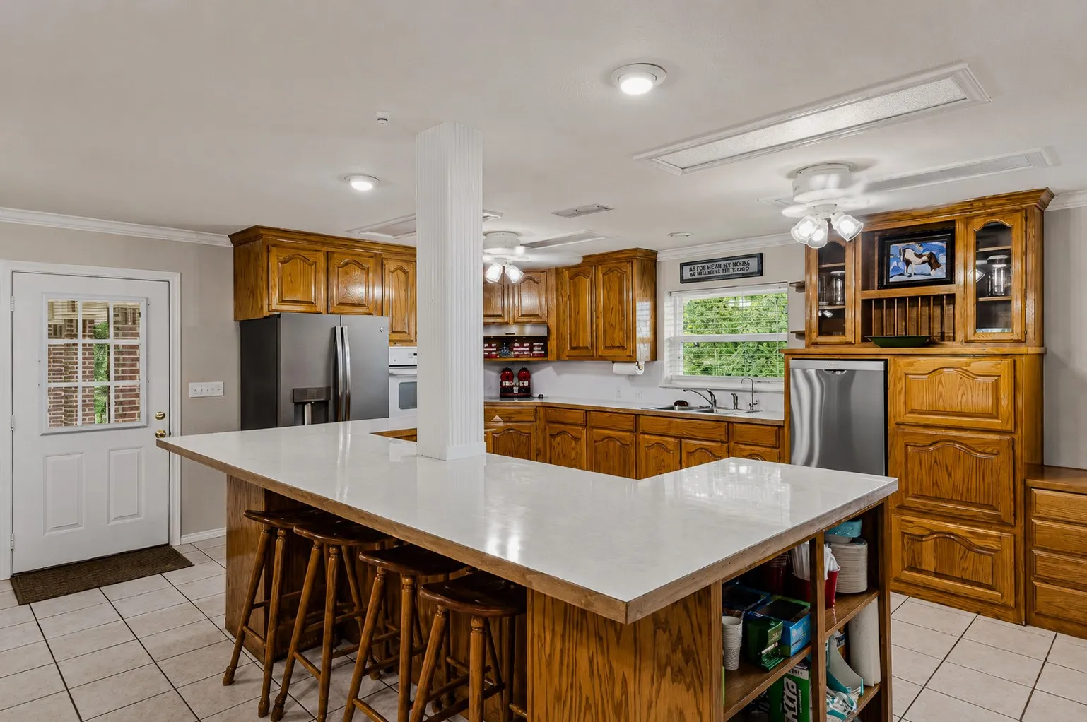 Large kitchen with island and plenty of bar seating of 339 Colwell Rd in Forestburg, TX