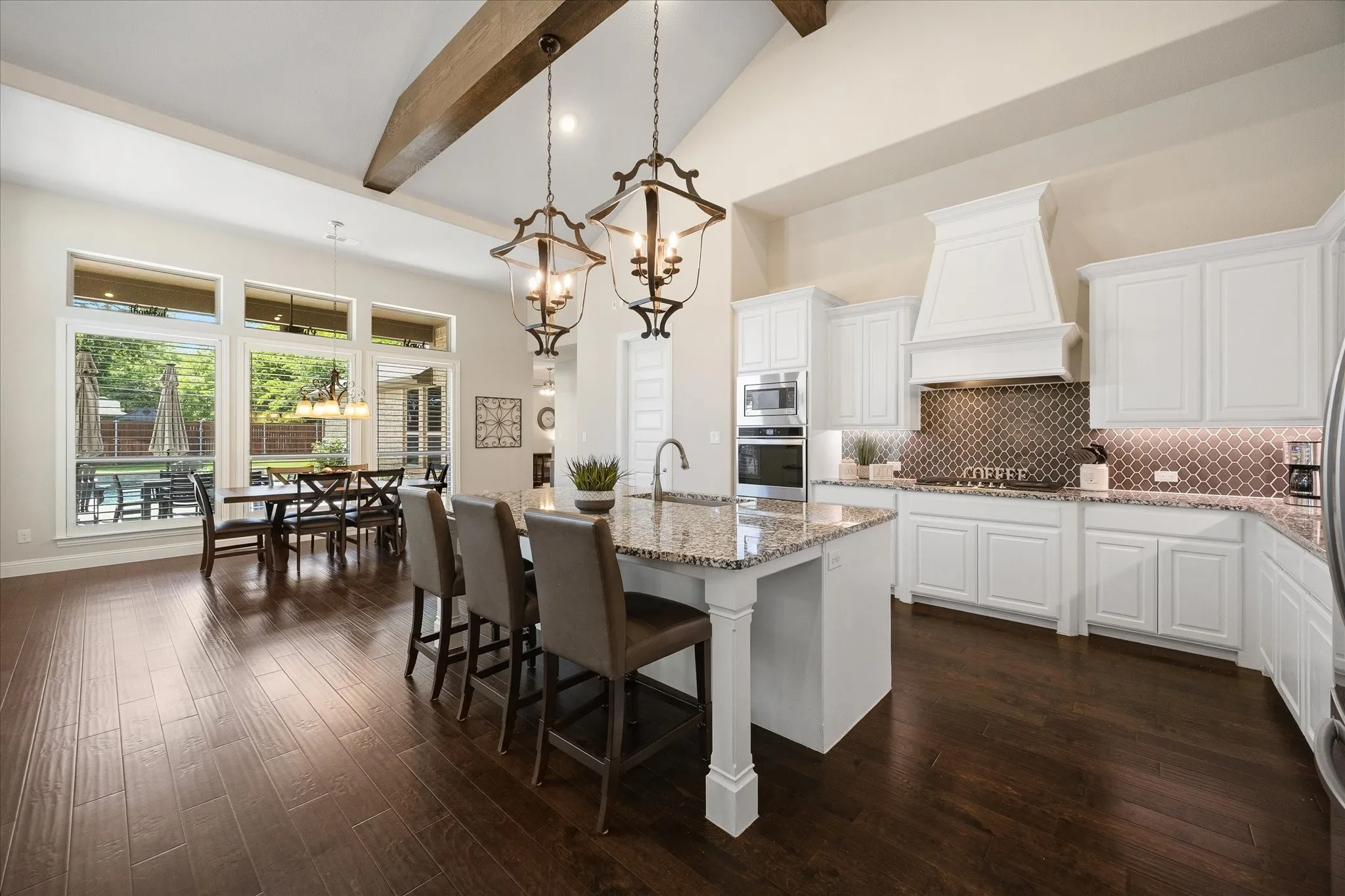 Open floor plan features kitchen overlooking dining area