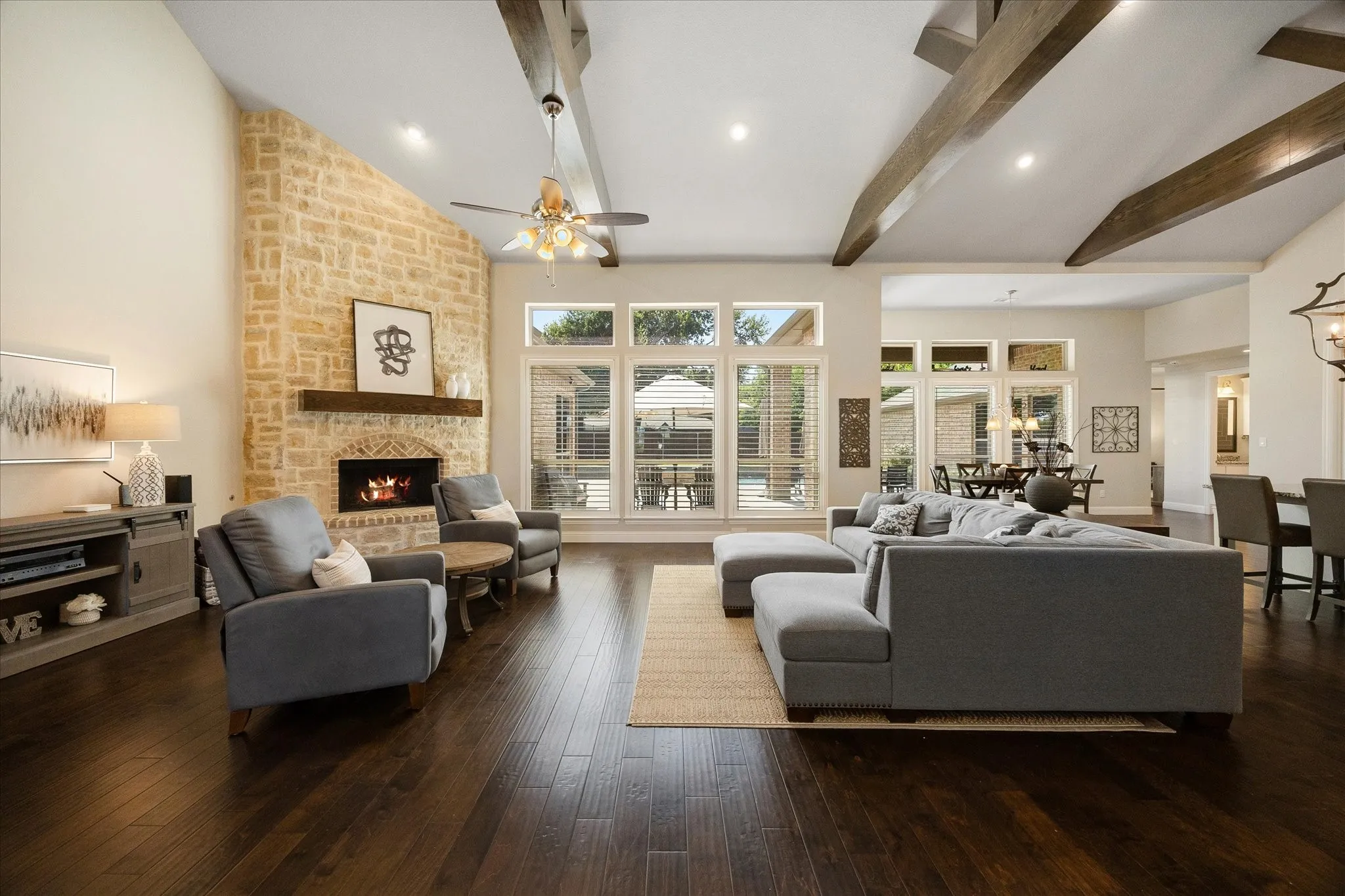 Fabulous family room includes views of out door living areas and sparkling pool!